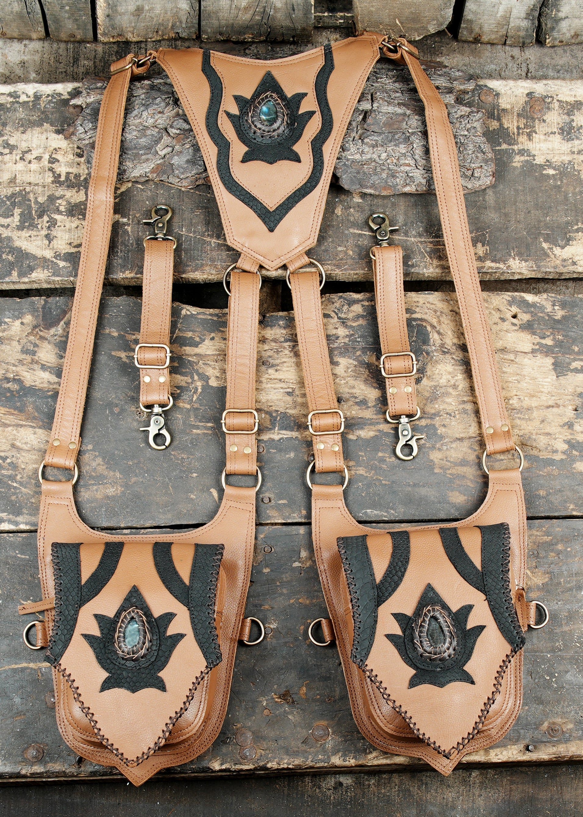 “Black and white leather holster with dual storage pockets and tribal art”