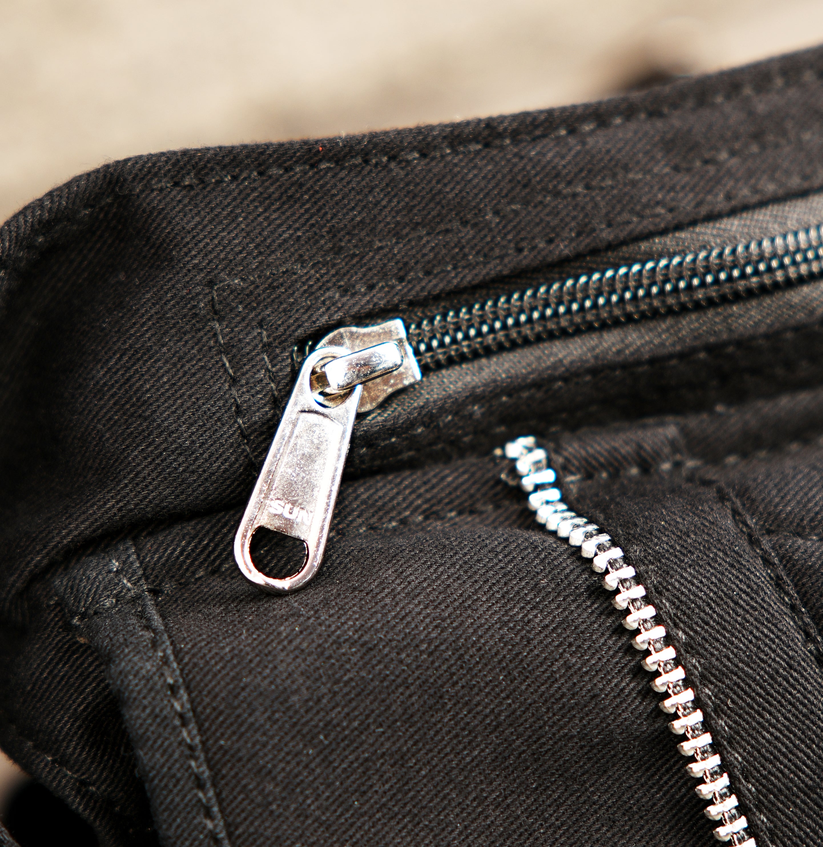 Compact black canvas waist pack for daily essentials