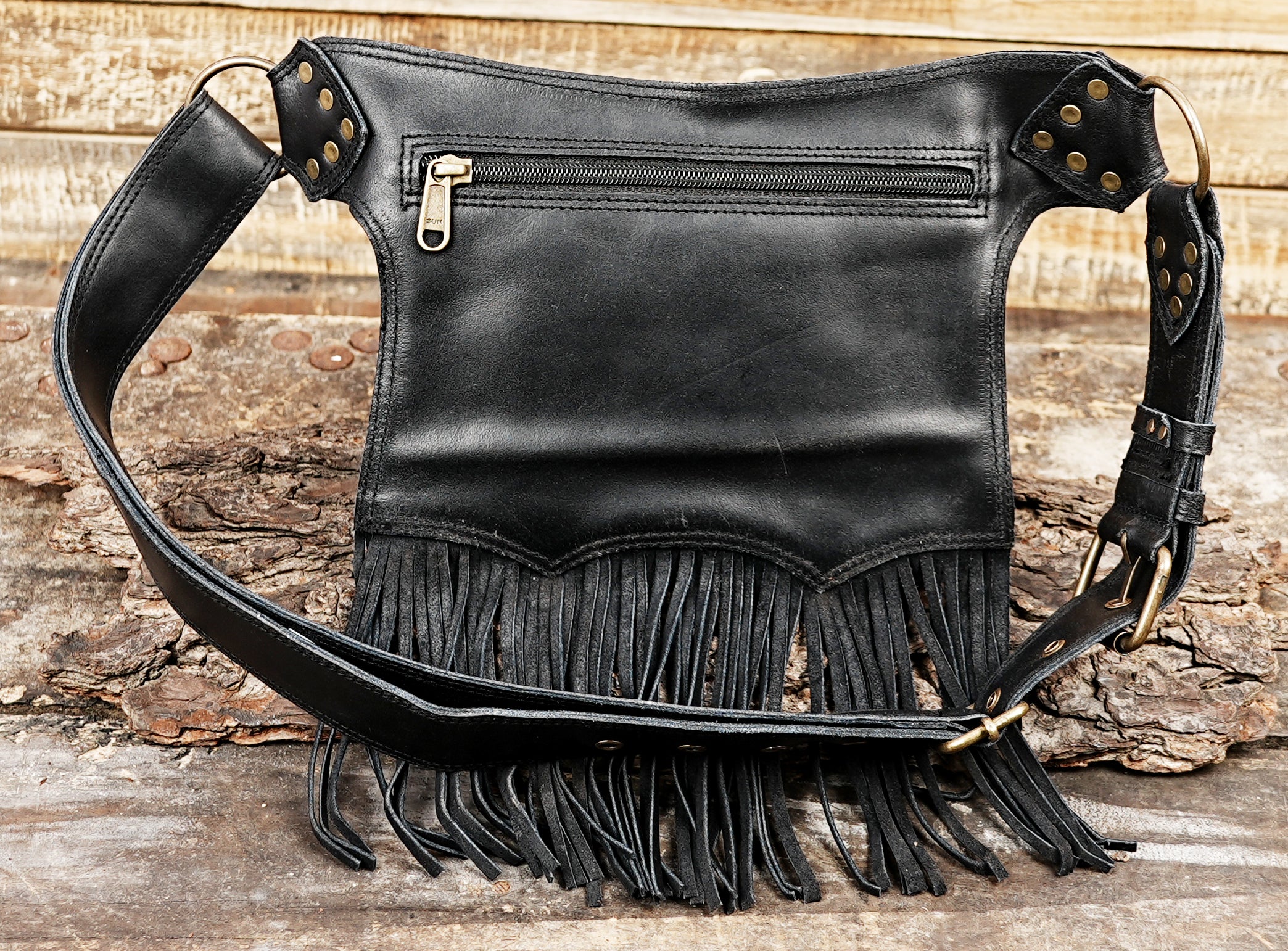 Western inspired leather hip belt with red textured leather and metal studs