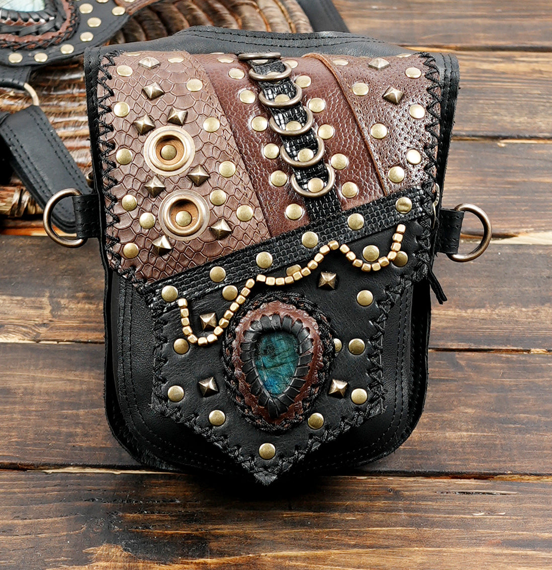 Black and brown leather holster with decorative stone inlay