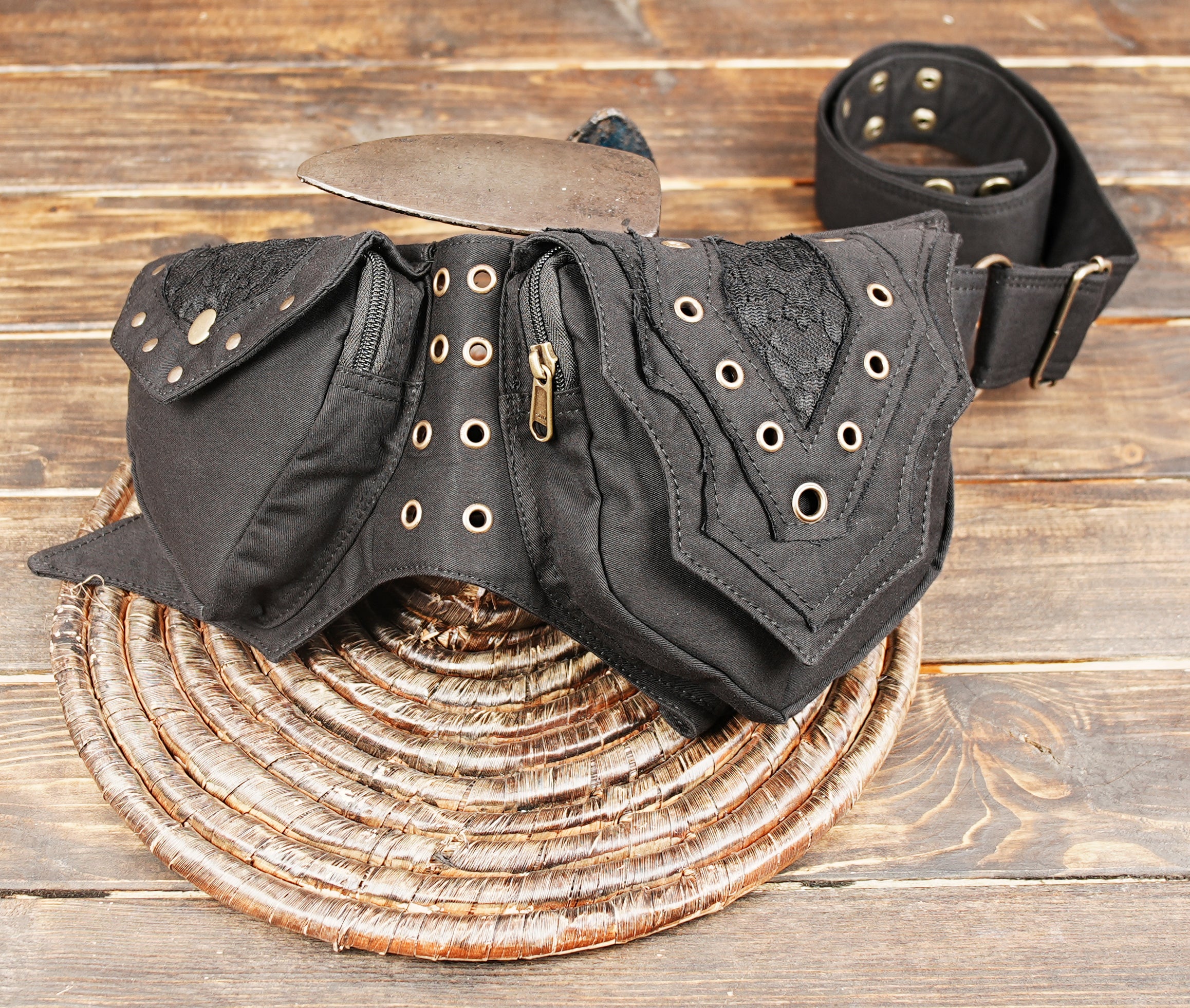Handmade festival hip bag with decorative eyelets and zipper pockets