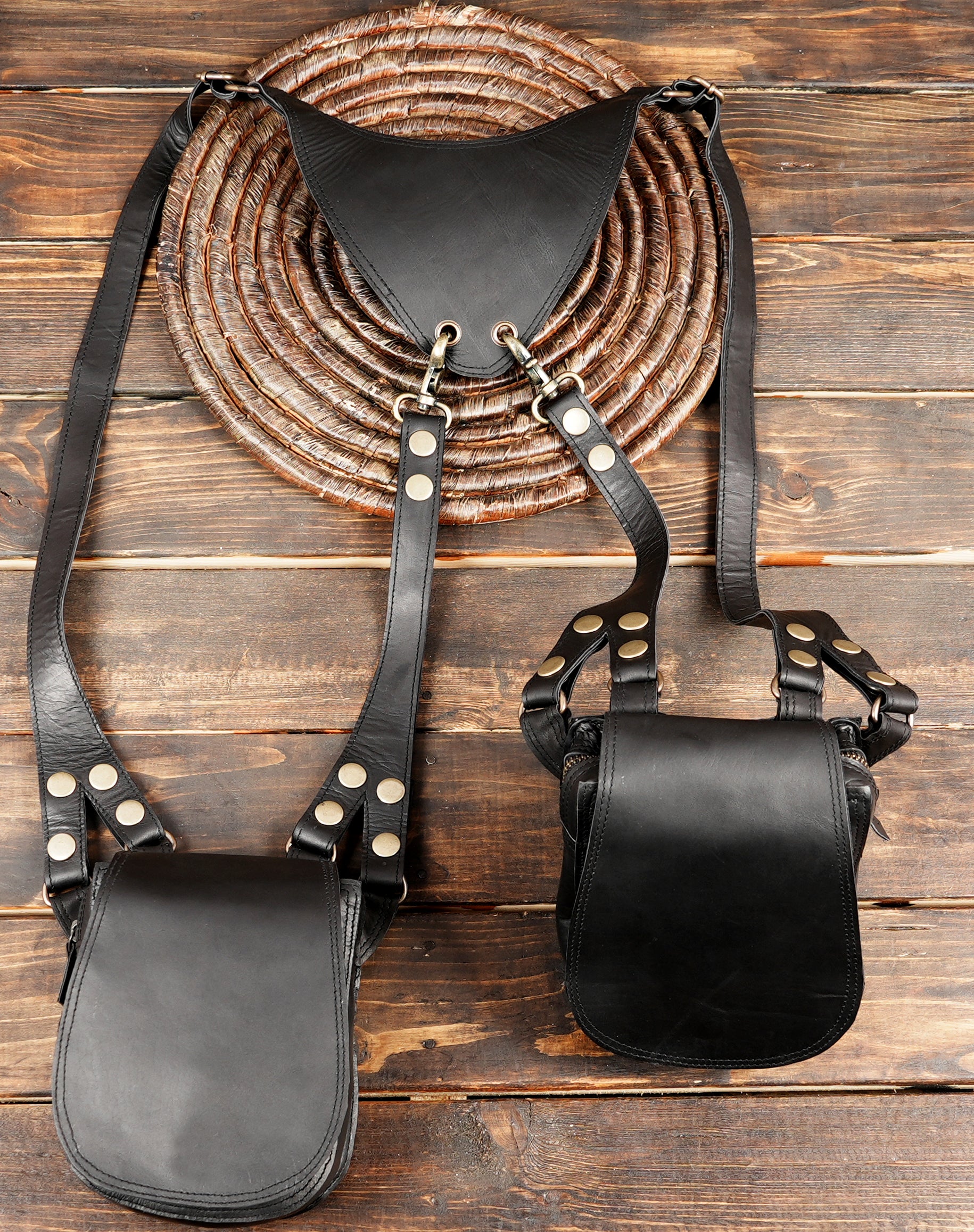 Artisan leather holster with smooth flap pockets and rivet accents