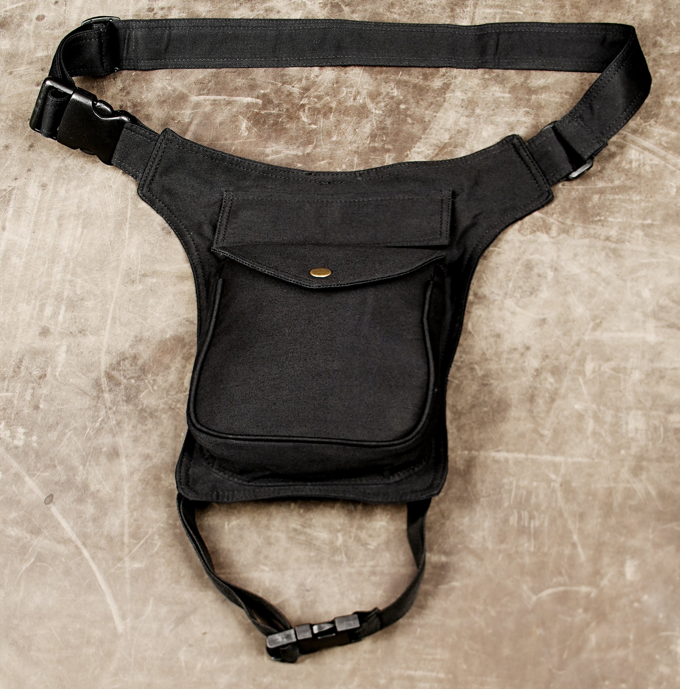 Black adjustable leg pouch bag for outdoor adventures and travel.