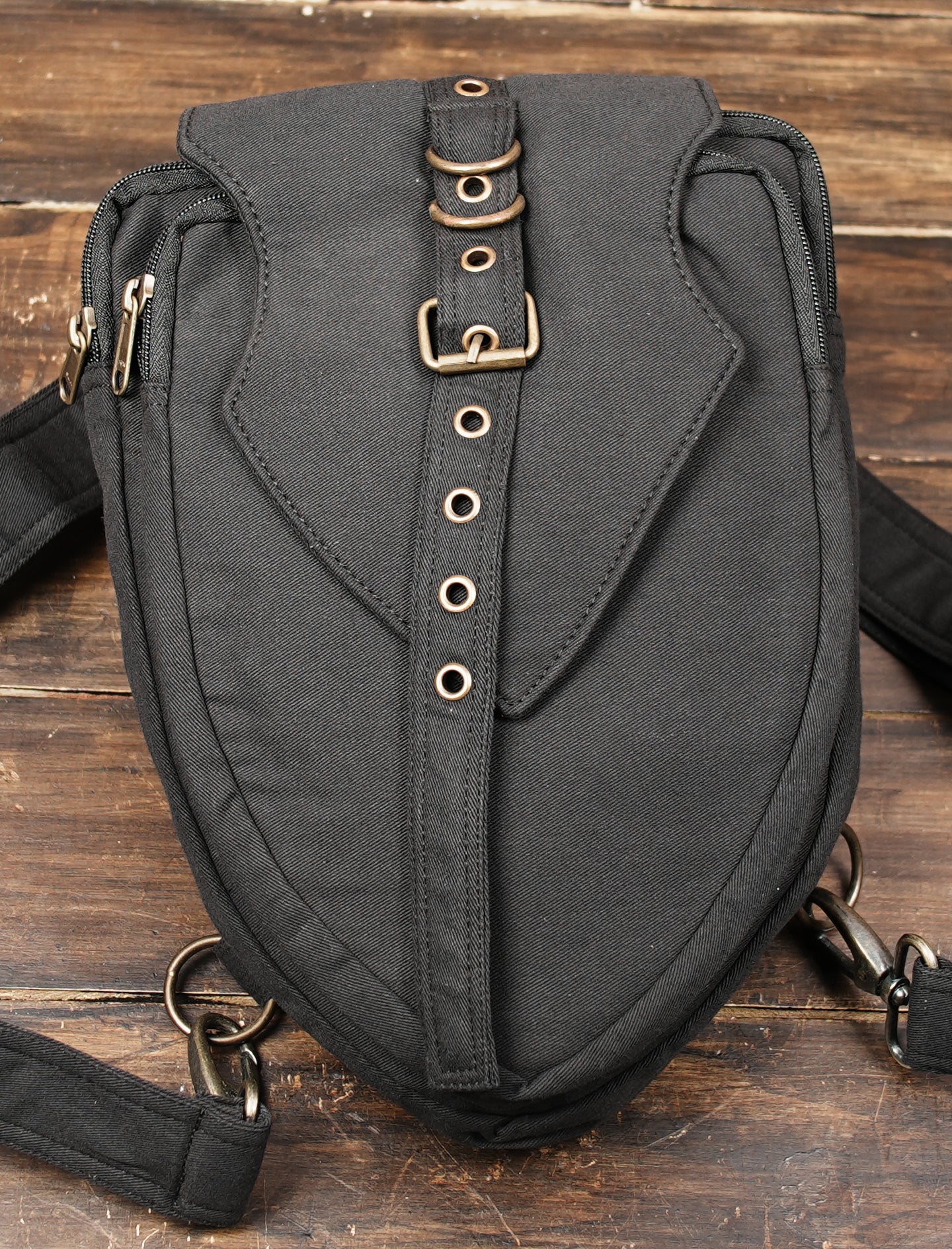 Vintage-inspired black cotton shoulder bag with metal hardware