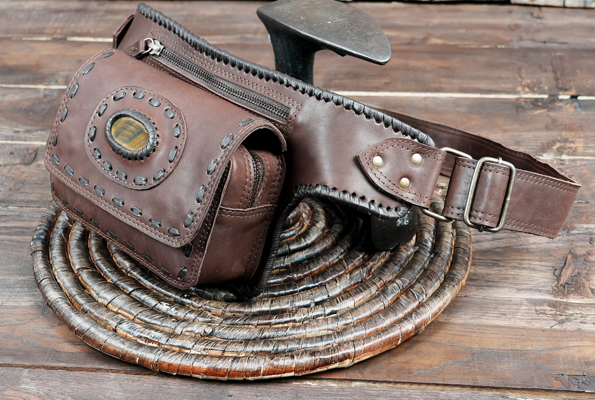 Western-style brown leather waist pouch with gemstone centerpiece
