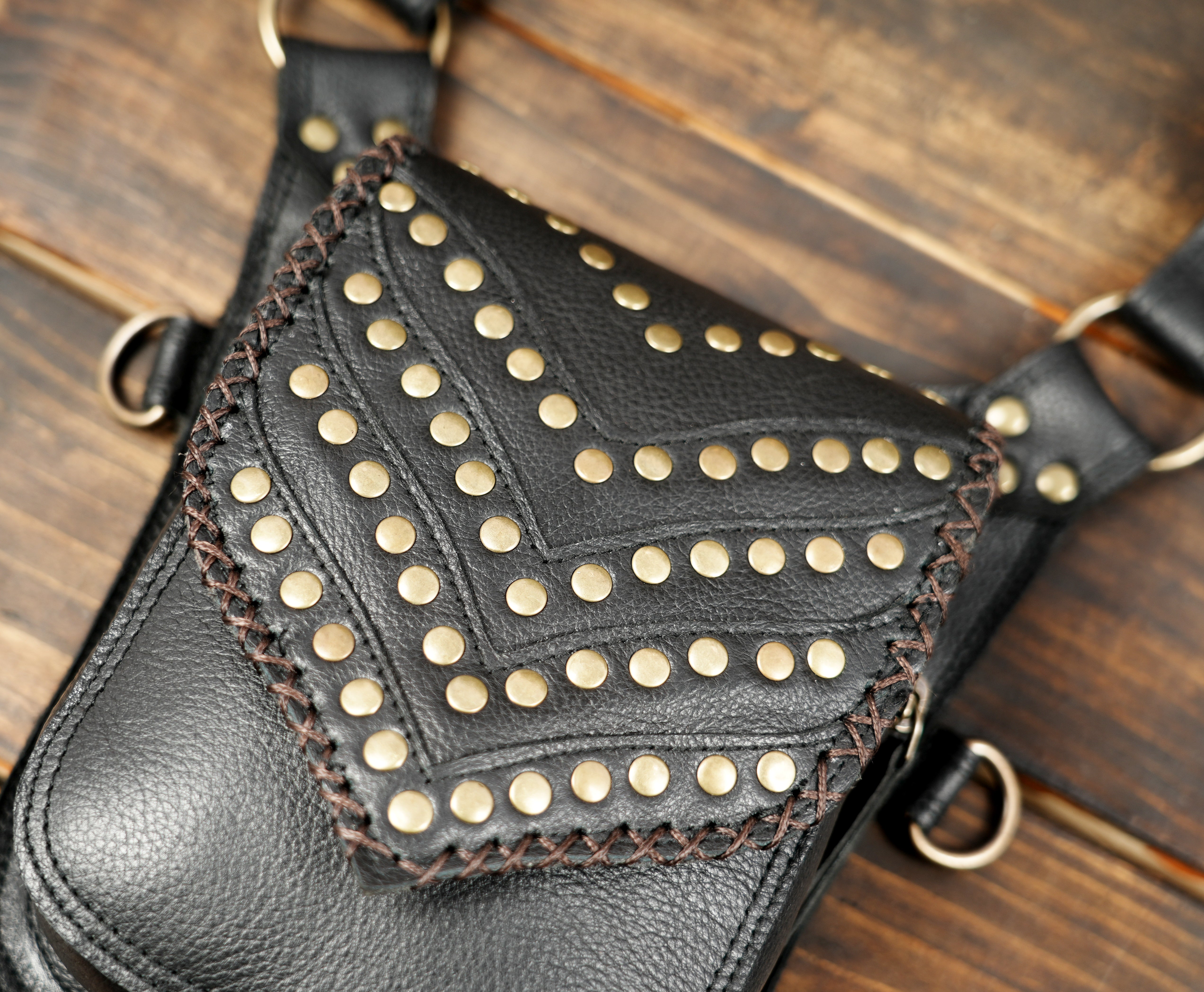 Festival leather holster harness with decorative metal detailing