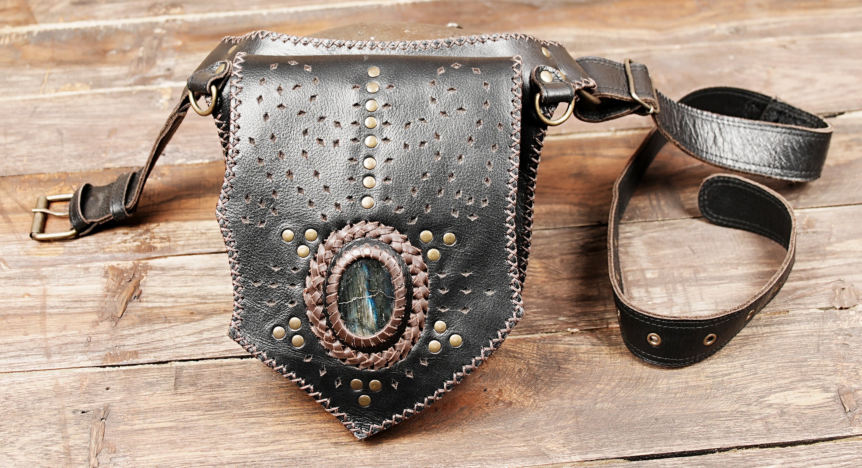 Handmade leather belt pouch with tribal pattern and rivet work