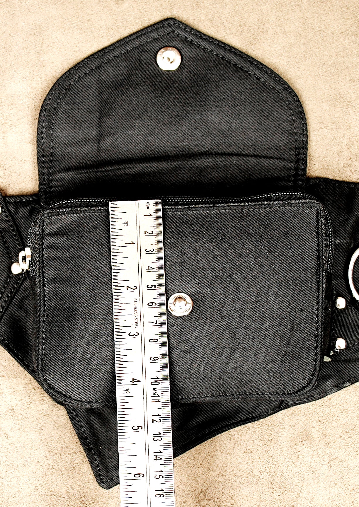 Hands-free travel organizer belt in black canvas with secure pockets for essentials.