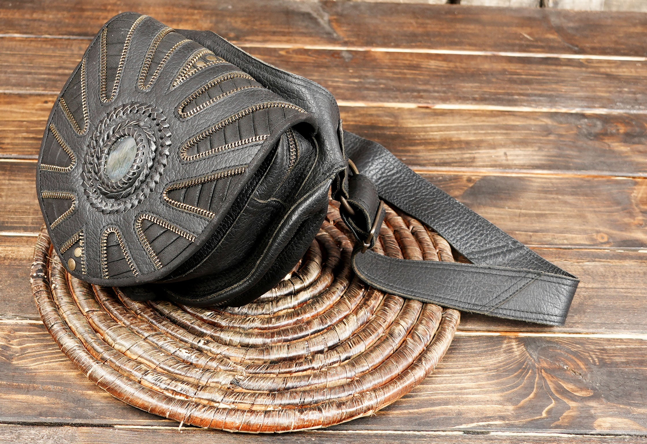 Boho style leather waist pouch with decorative stitching and gemstone