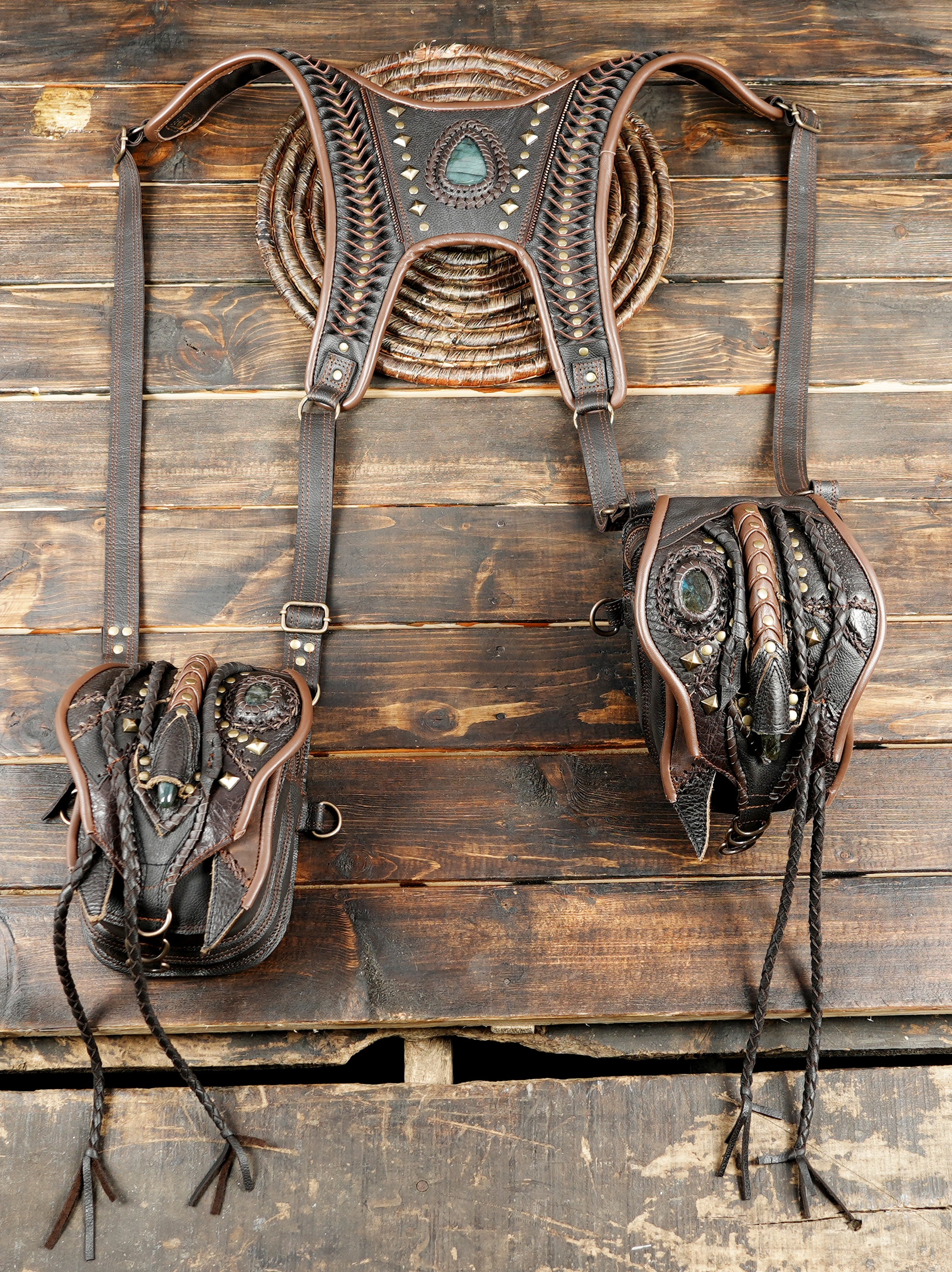 leather utility holster with gemstone inlay and braided embellishments”