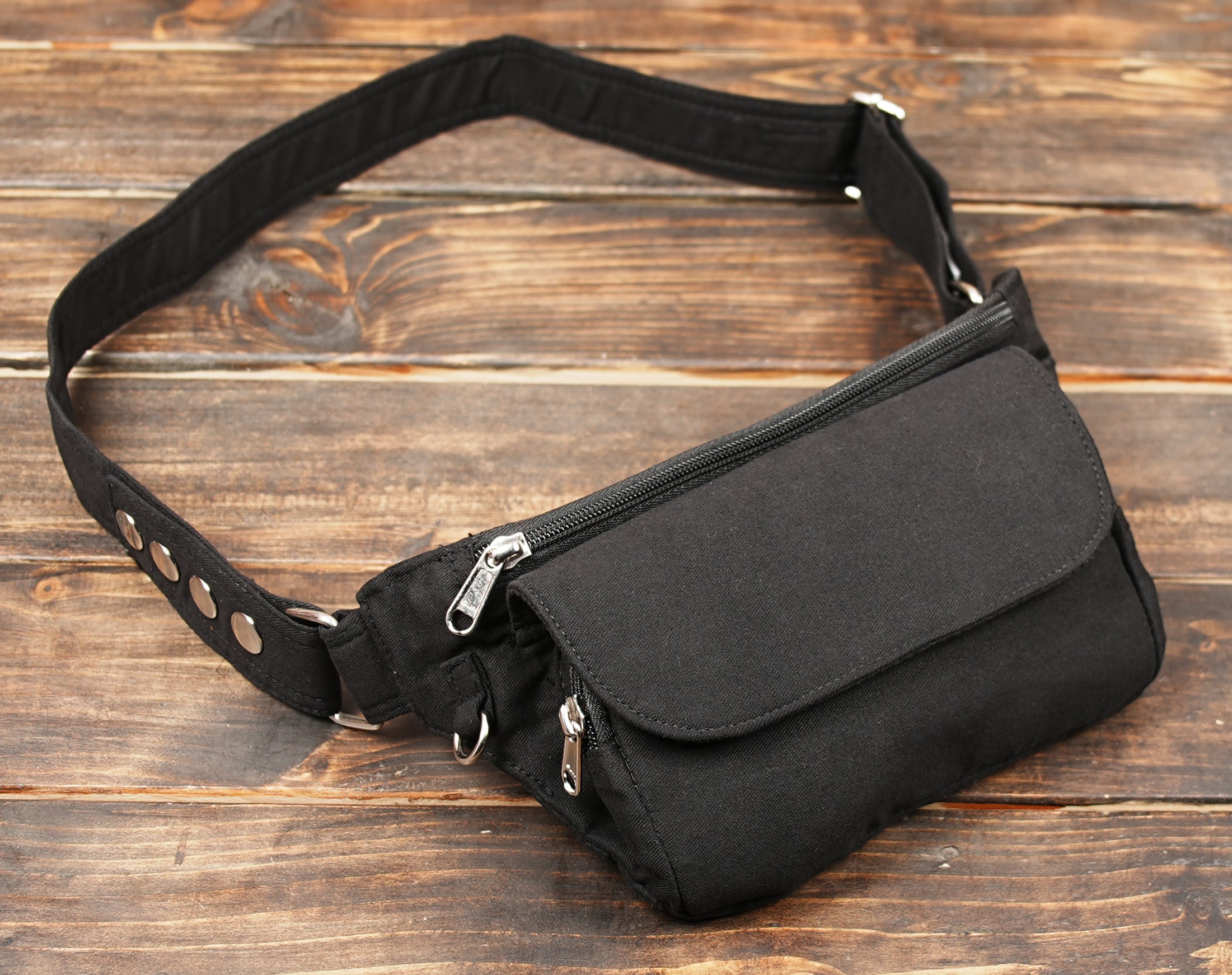 Unisex black waist bag with adjustable canvas strap