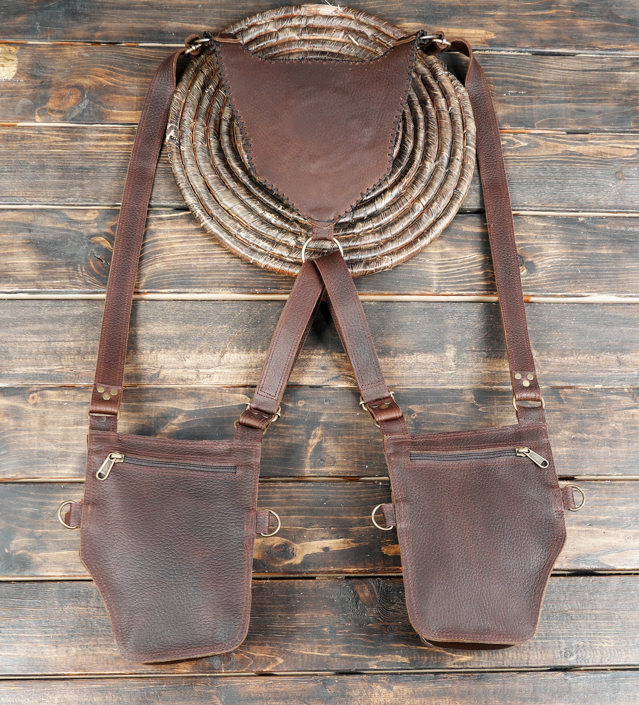 Custom leather body rig with artisanal stitching