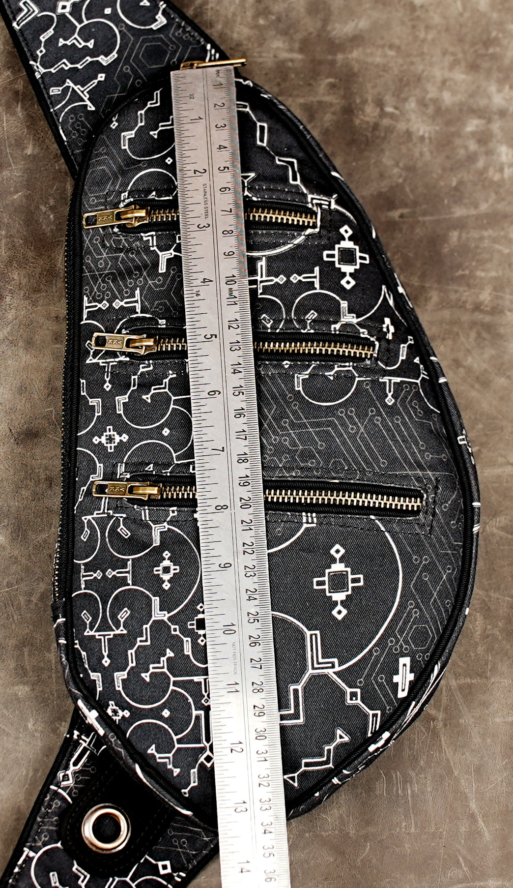 Black techwear chest bag with circuit board style graphic print