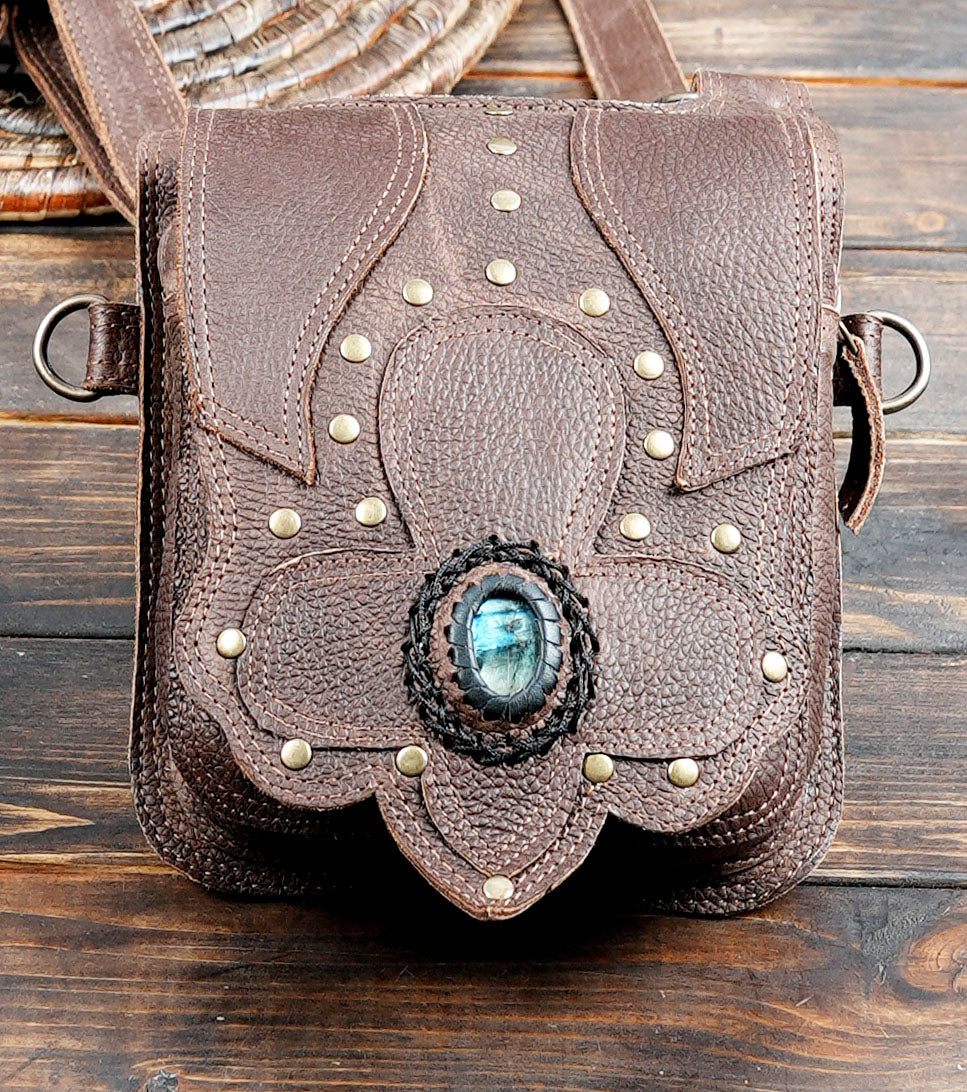 Rustic brown leather shoulder holster with adjustable straps