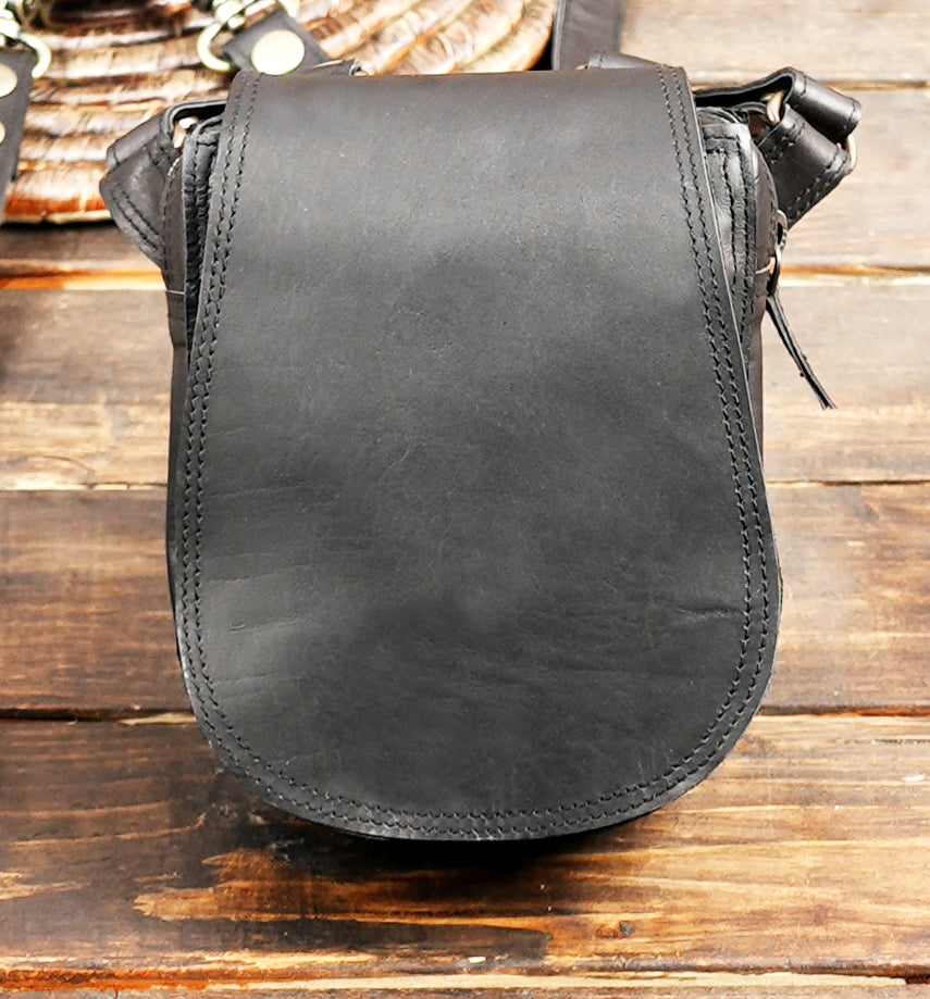 Handmade black leather holster harness with metal rivet details