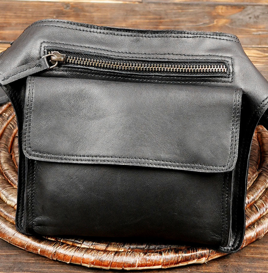 Adjustable black leather belt bag designed for hands free carry