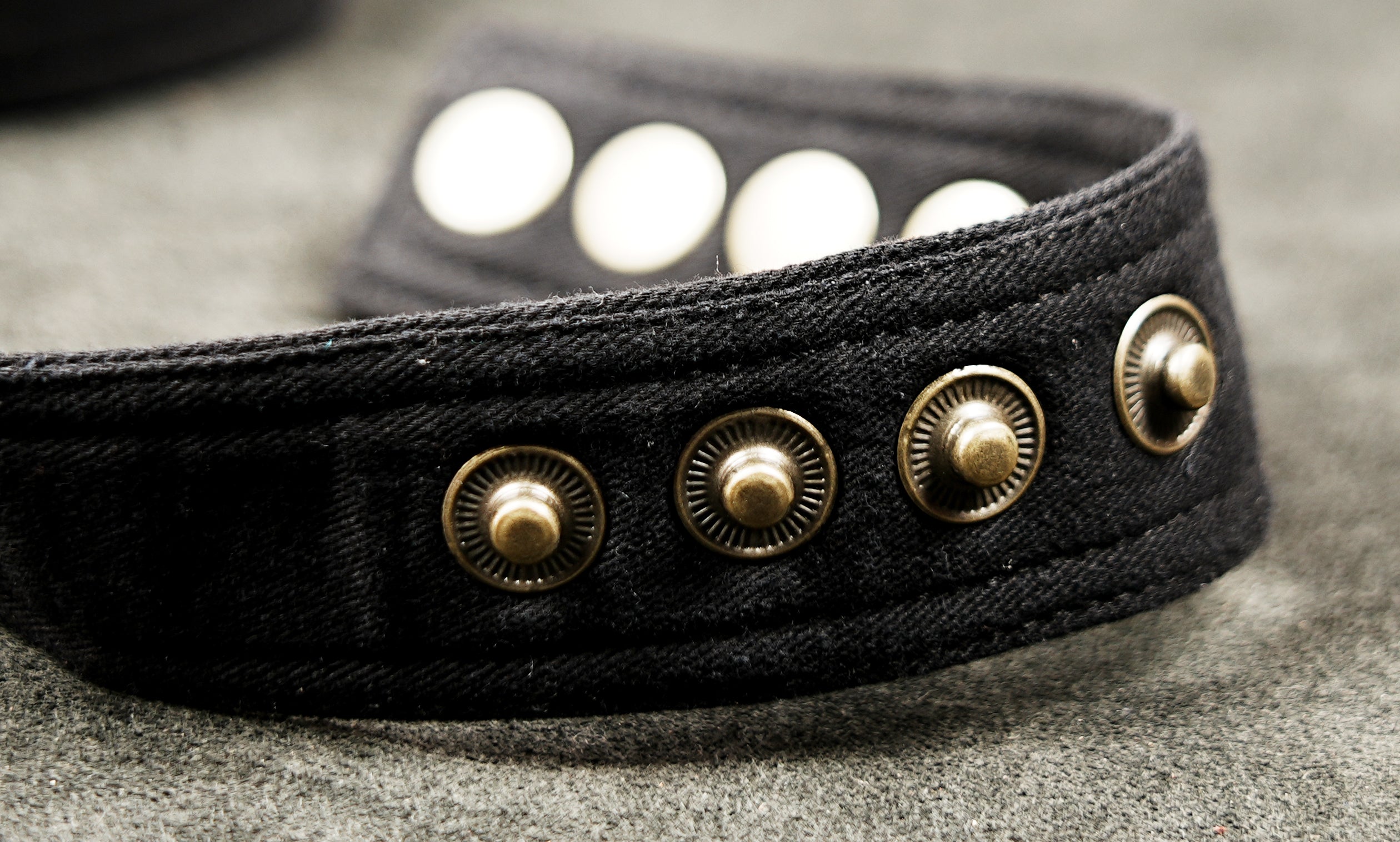 Black canvas utility waist belt with side thigh pocket and metal studs