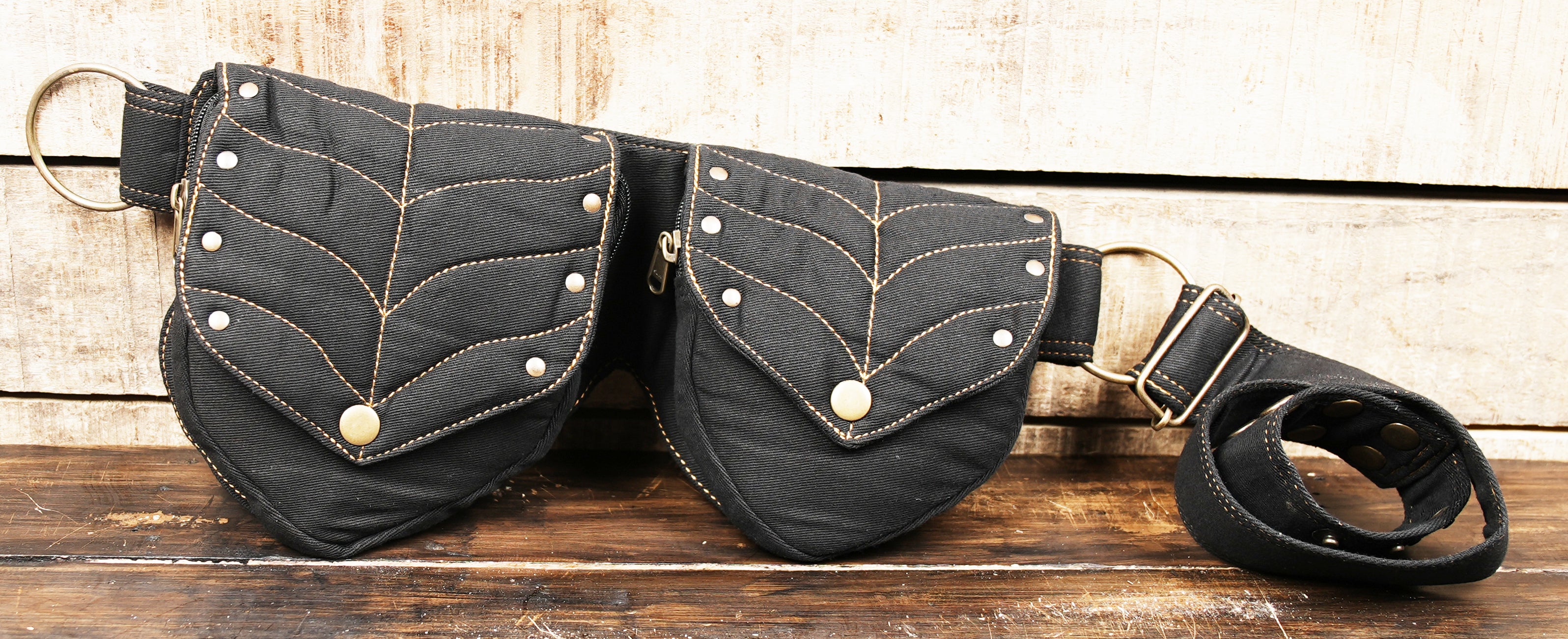 Cool and alternative fanny pack, black cotton with contrast stitching and metallic gold accents for festivals.