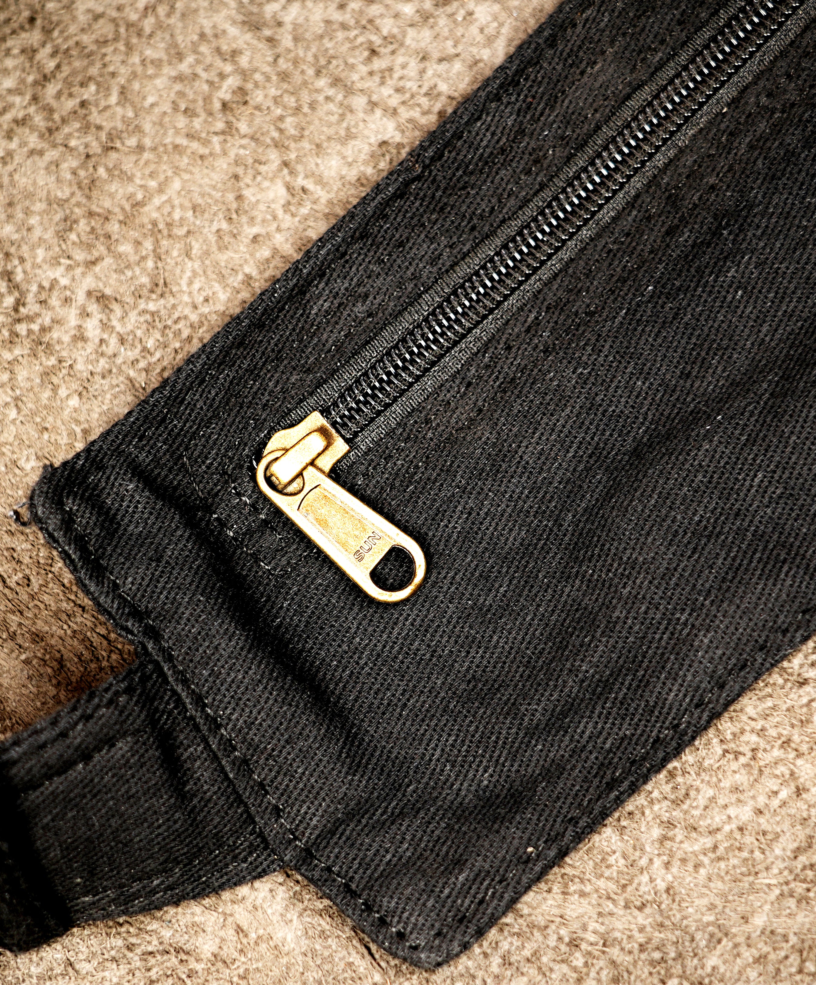 Multi-pocket utility waist bag in durable black cotton