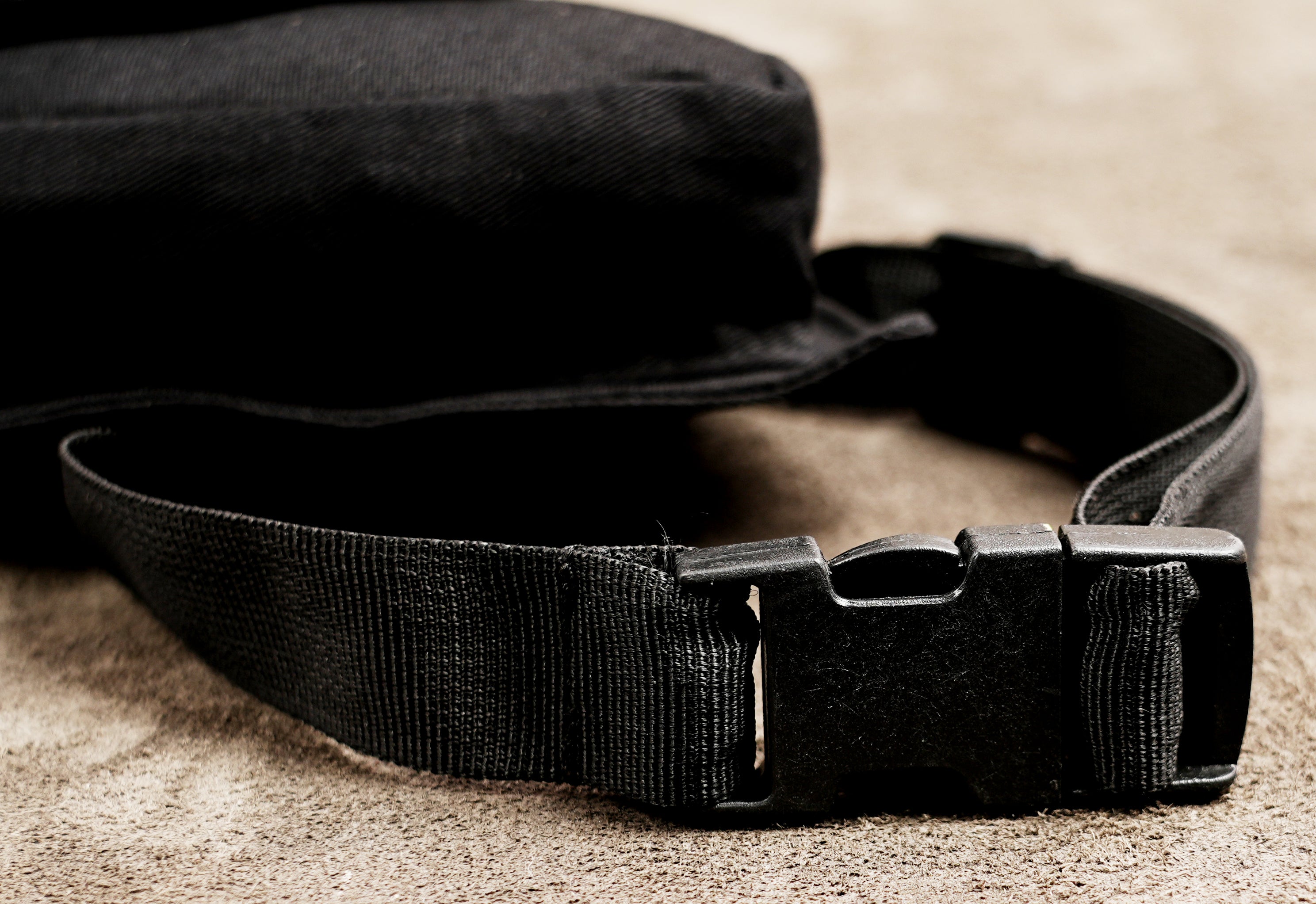 Women's black festival fanny pack with thigh pouch and zip pockets