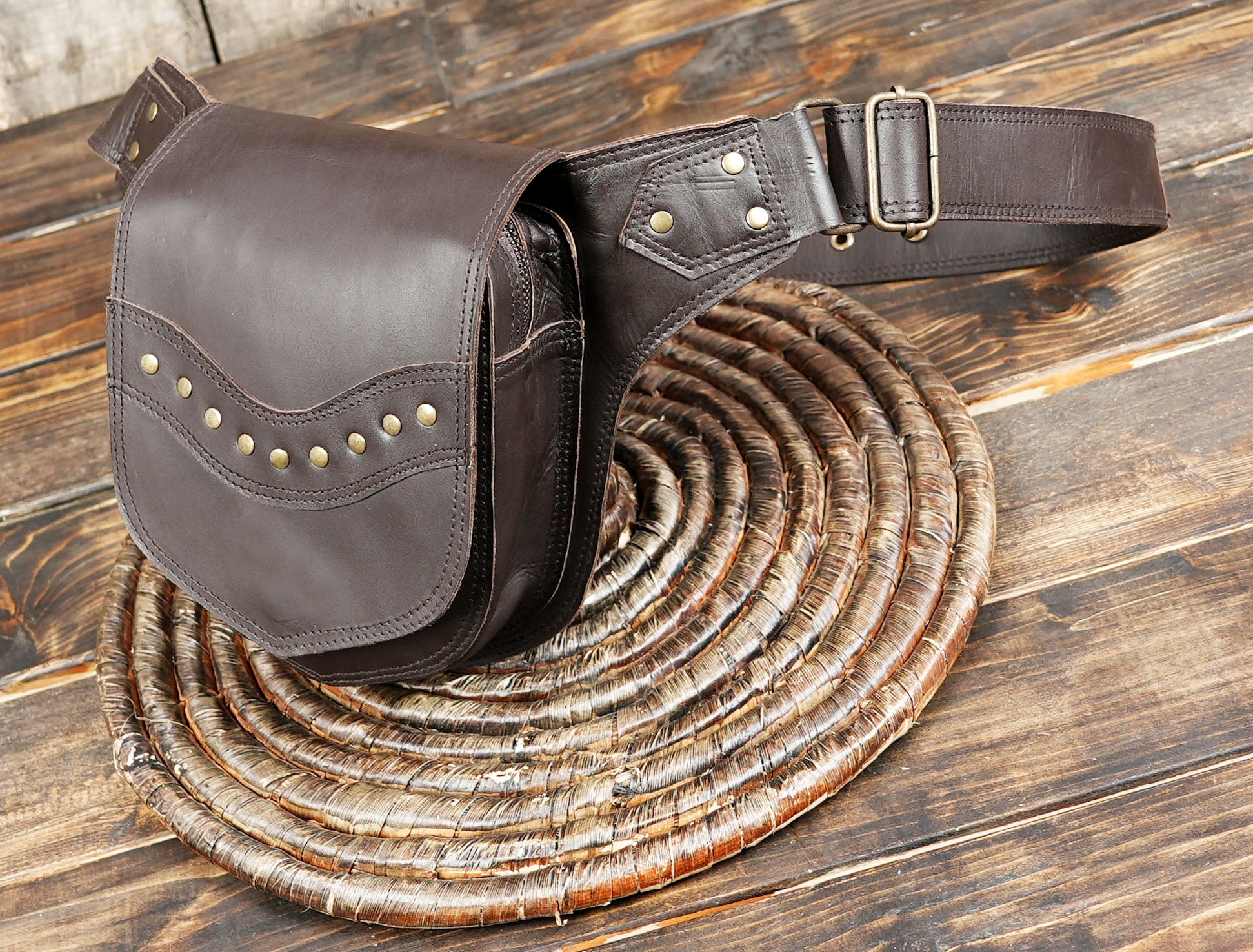 Boho inspired brown leather hip pack with rivet details