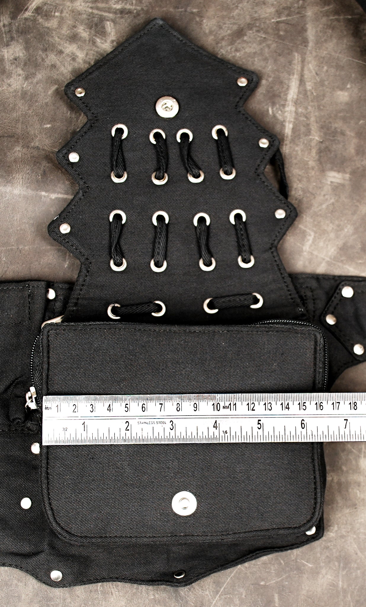 Black canvas utility belt pouch with integrated metal hardware.