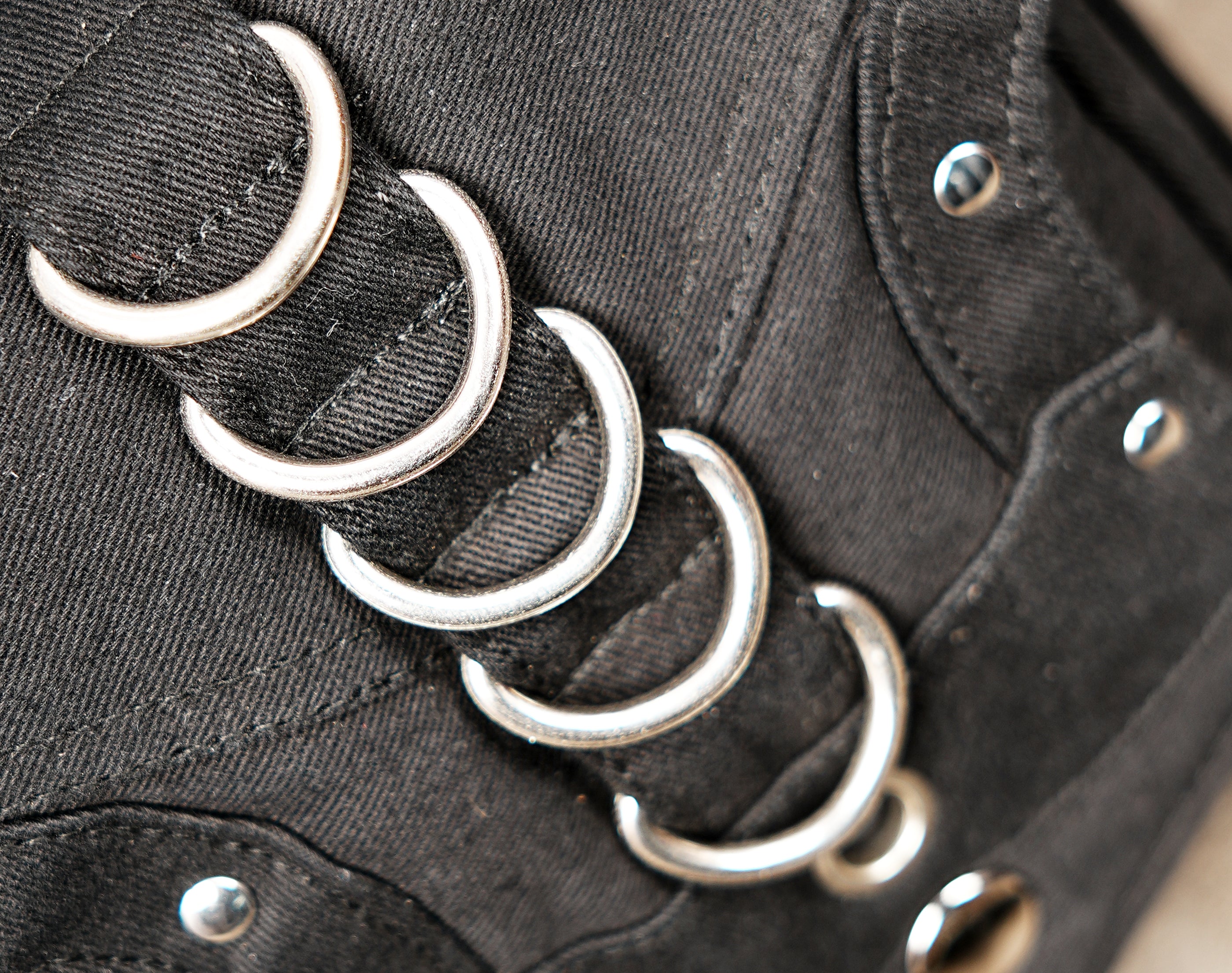 Steampunk style black canvas hip and leg bag with metal ring accents