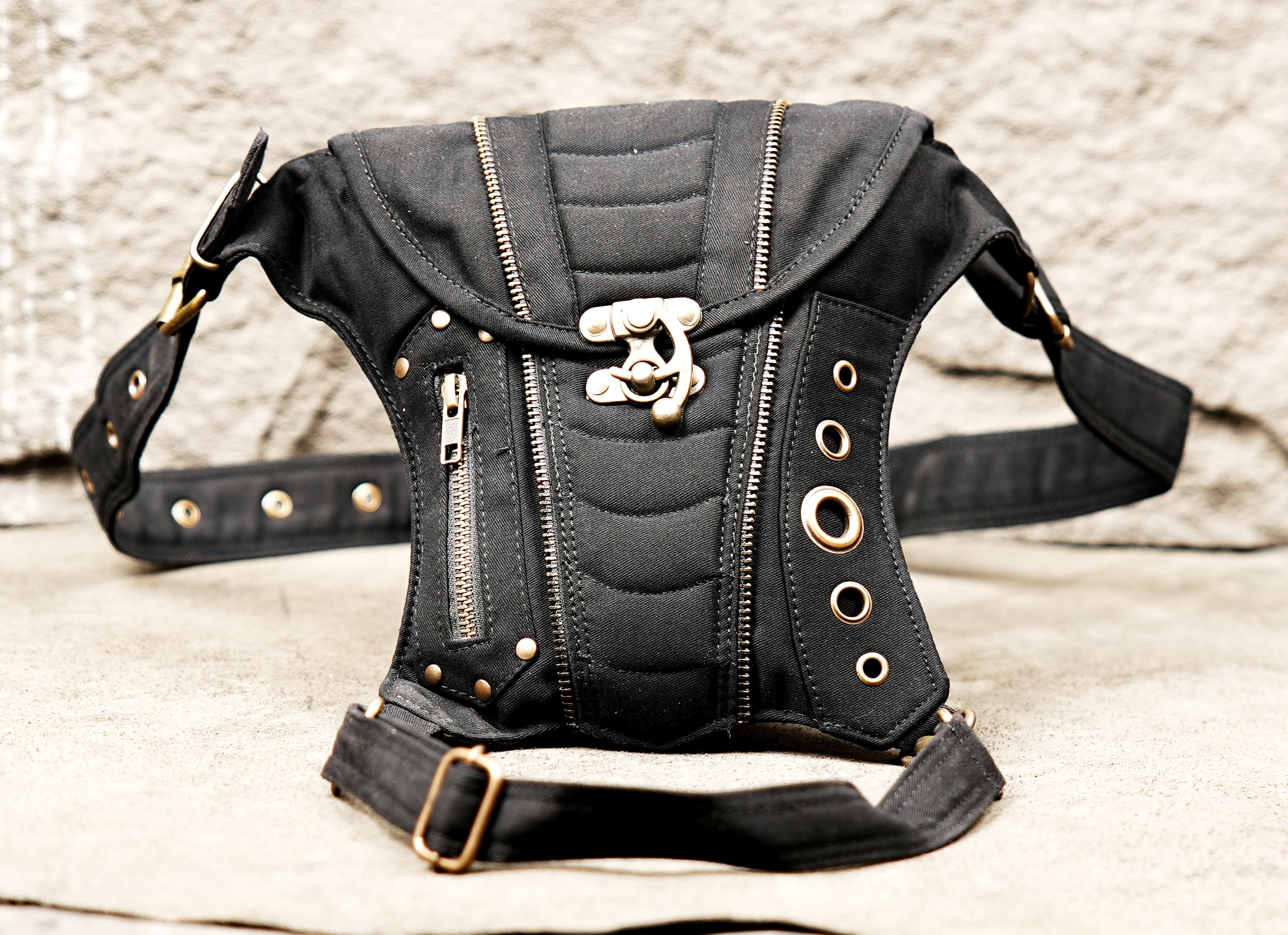 Festival thigh pocket belt with adjustable leg strap and decorative brass hardware.
