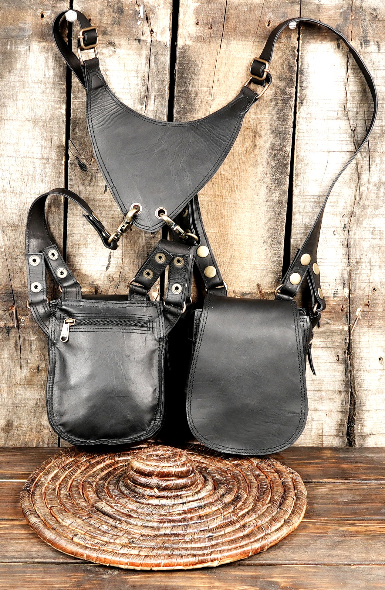 Black holster harness bag with sturdy straps and metal hardware