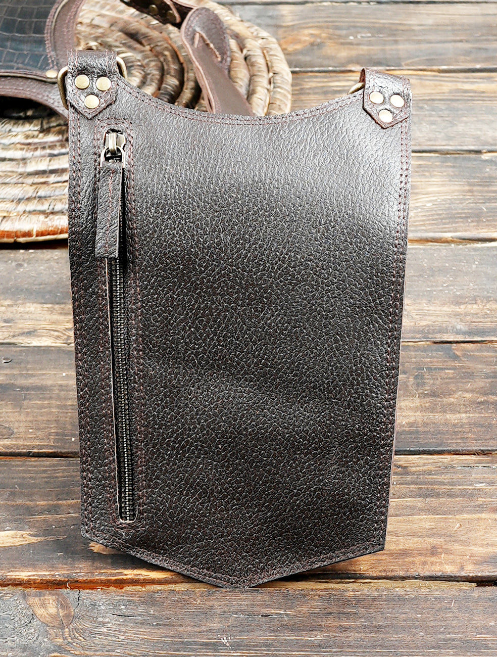 Rustic brown leather holster belt with adjustable buckle straps