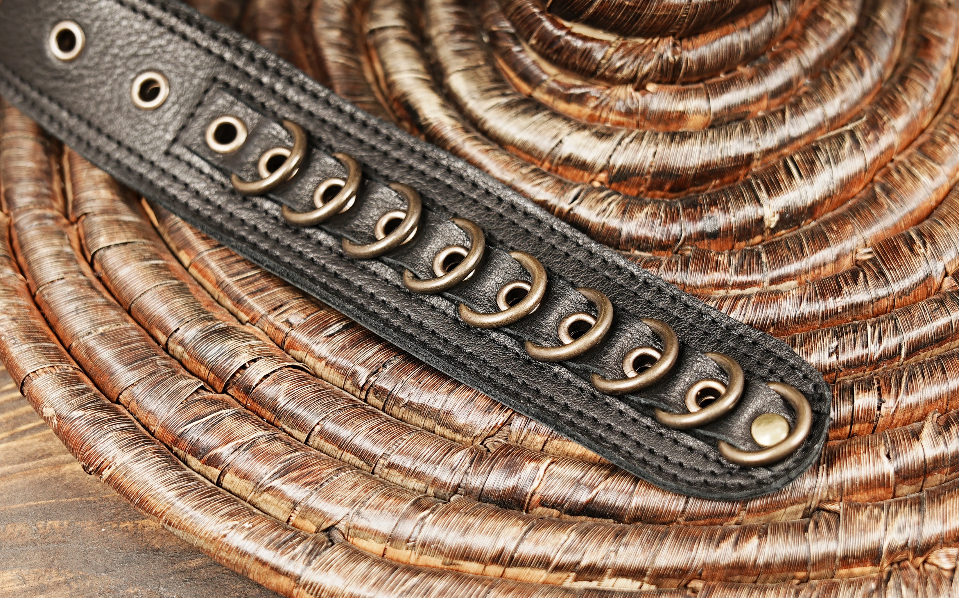 Artisan leather waist belt with decorative metal accents