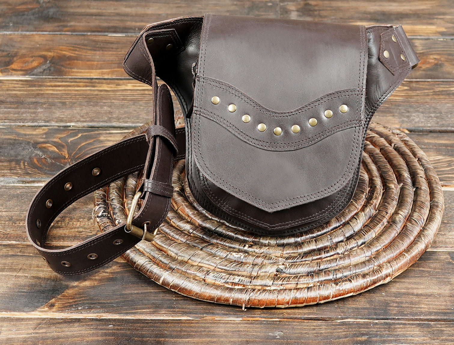 Brown leather festival pouch with rustic metal accents