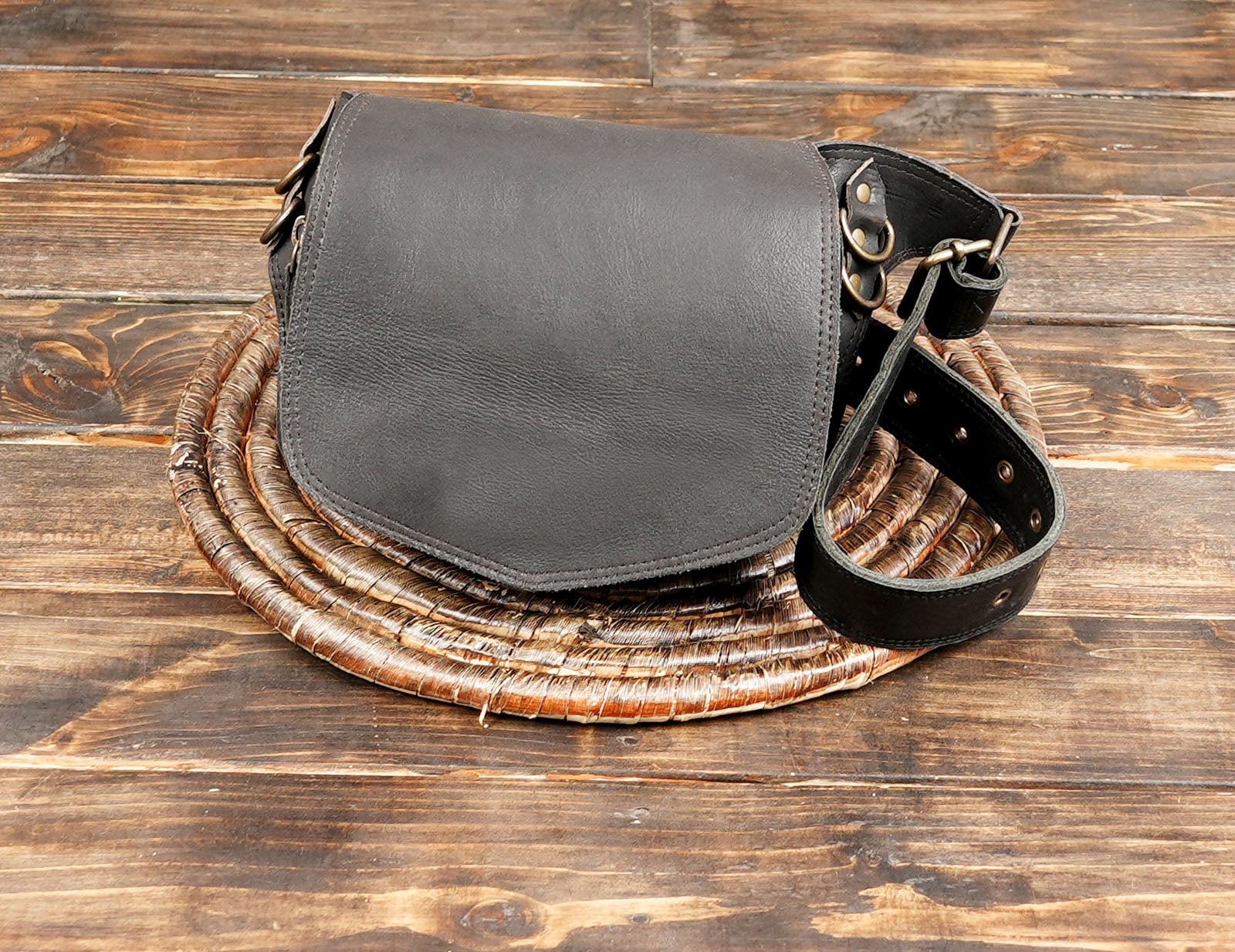 Gothic black leather hip bag with buckle closure