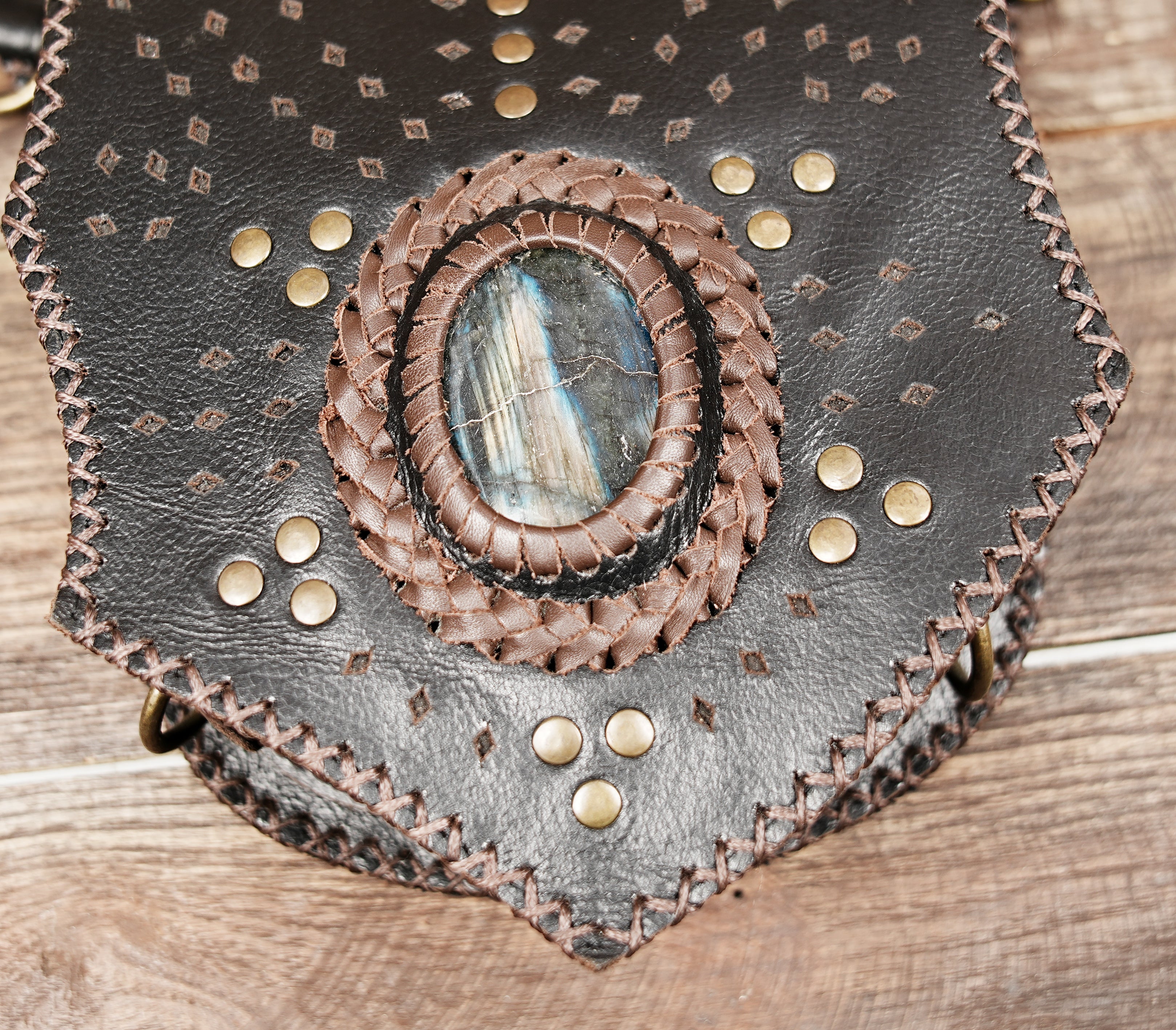 Tribal style leather waist belt with decorative rivets and stitching