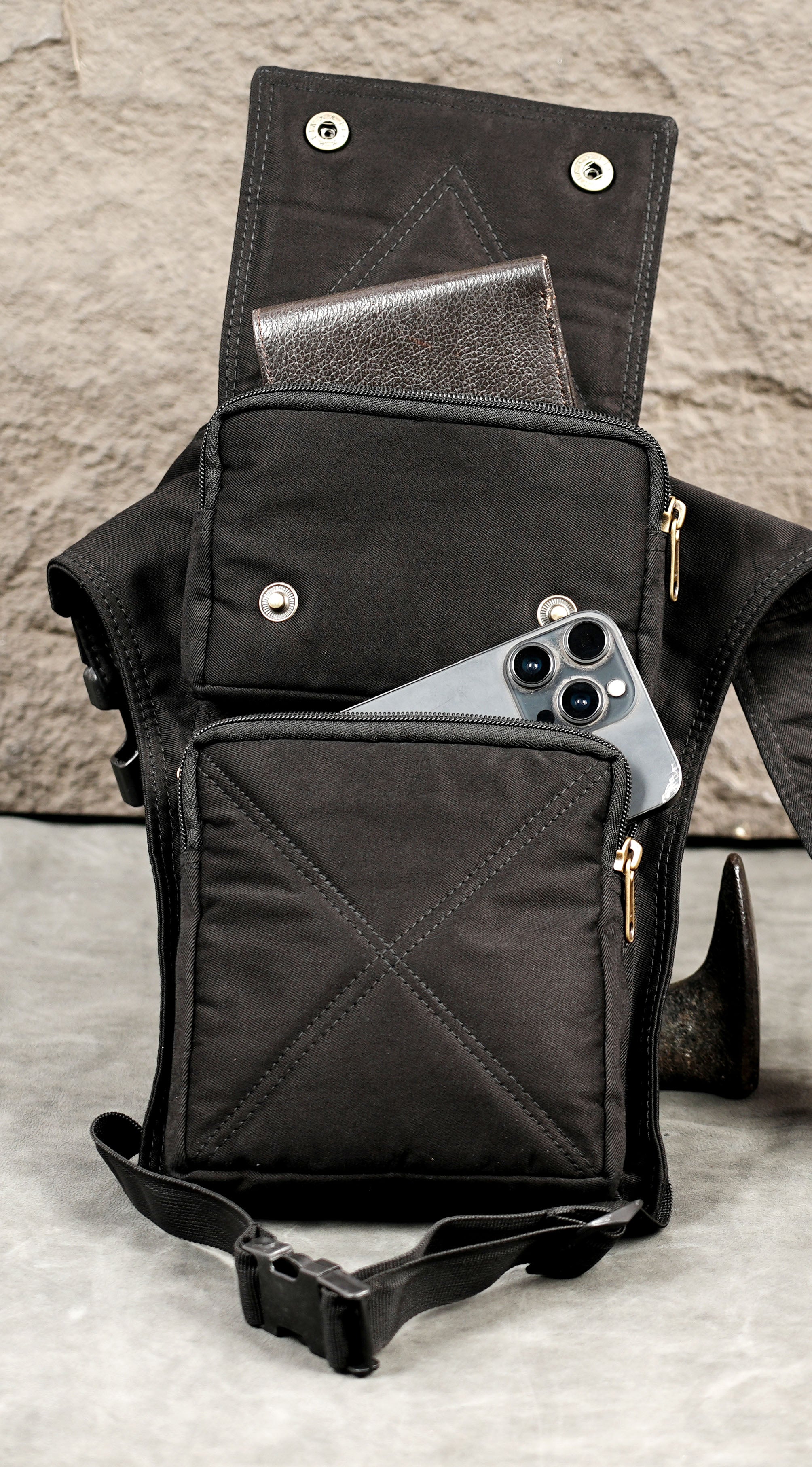 Black cotton waist and thigh strap bag with quick-release buckles