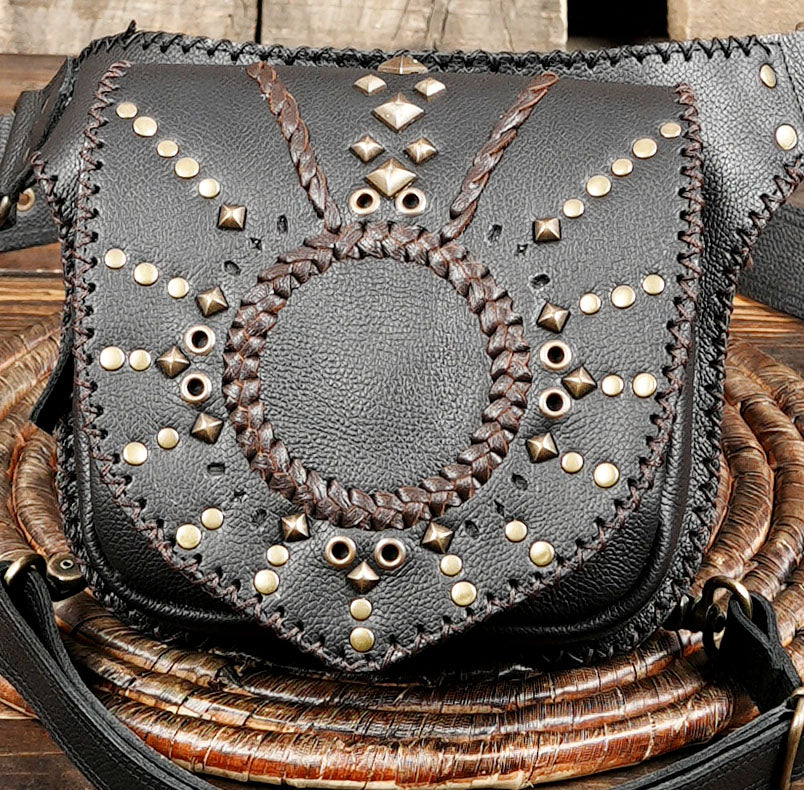 Back view of leather leg holster with zipper pocket and adjustable belt straps.