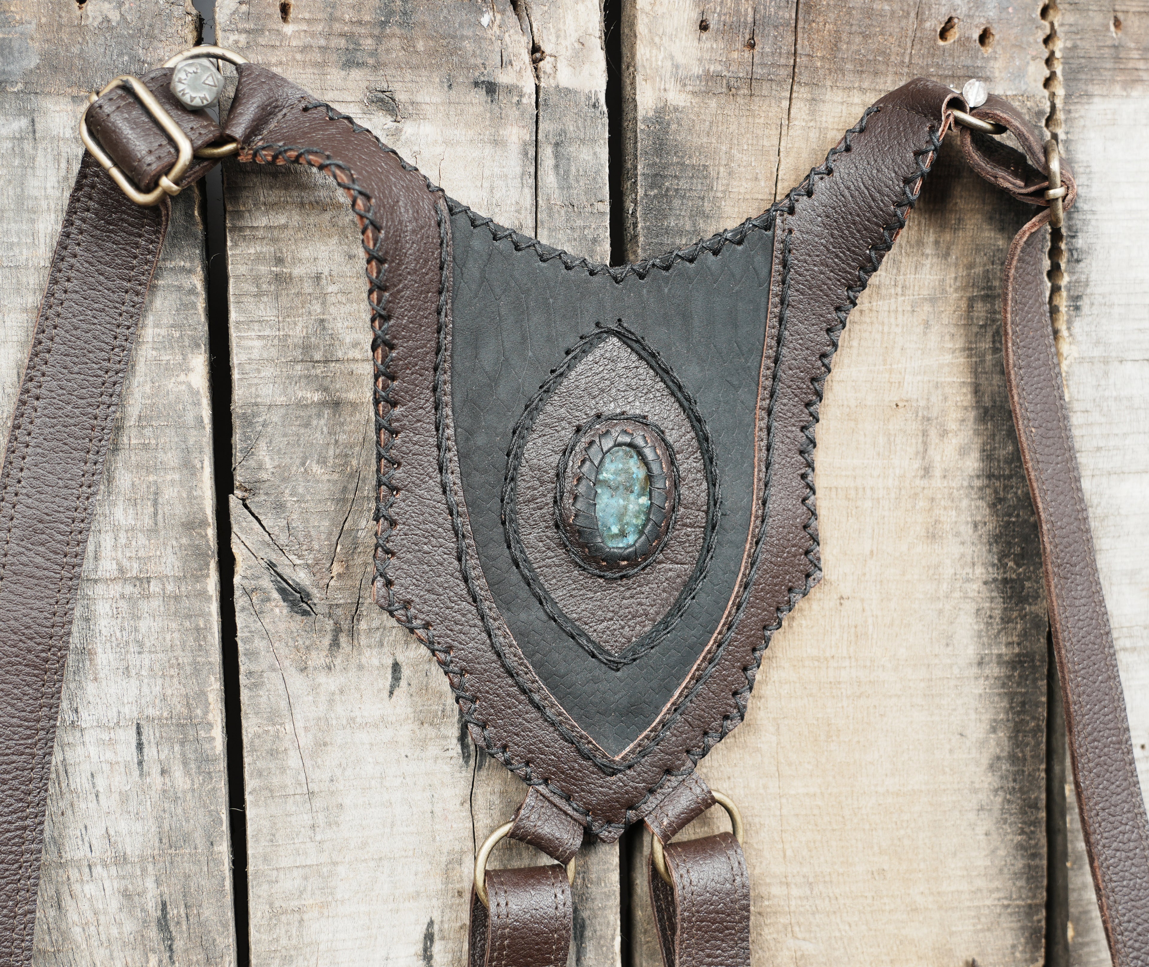 Premium dark brown leather holster with adjustable buckles and stone accents