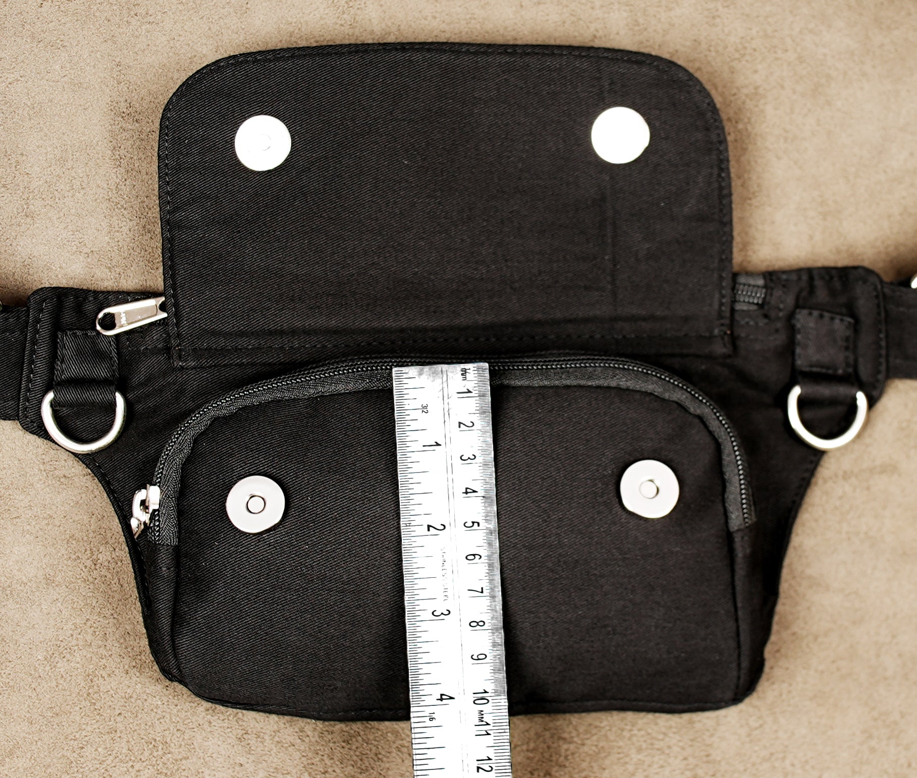 Compact black cotton hip bag designed for comfortable everyday travel.