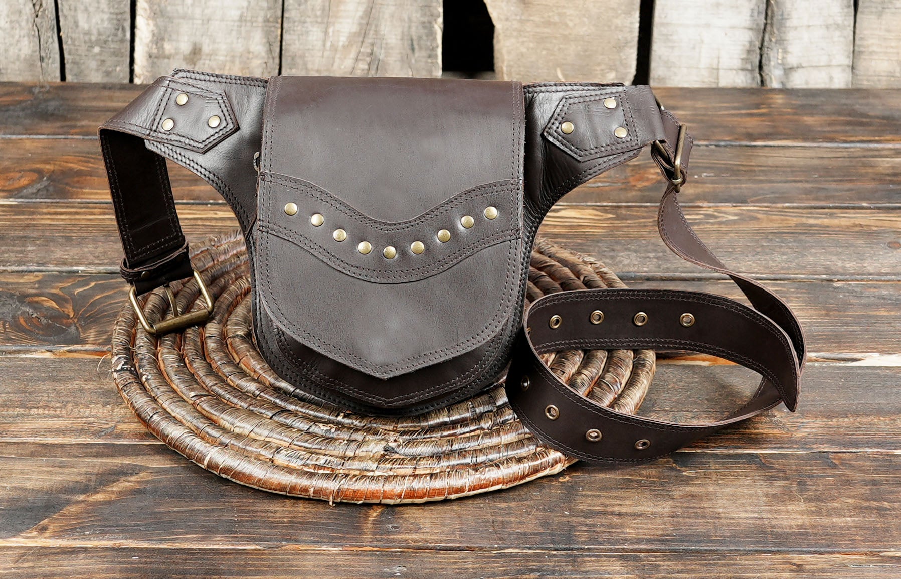 Classic leather waist pack with studded decorative pattern