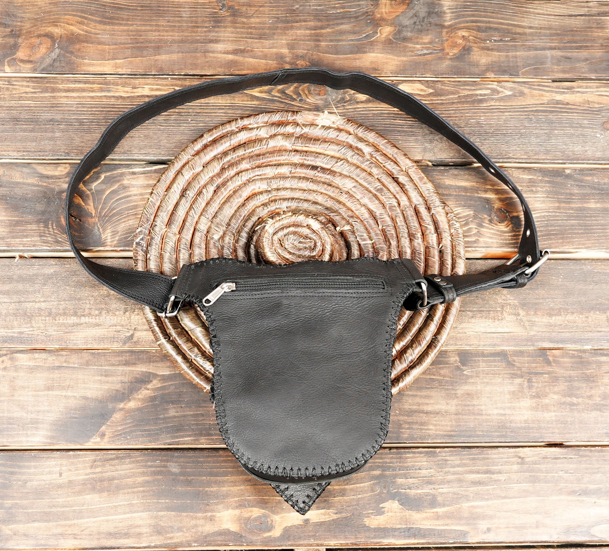 Handmade black leather waist belt with unique center ornament