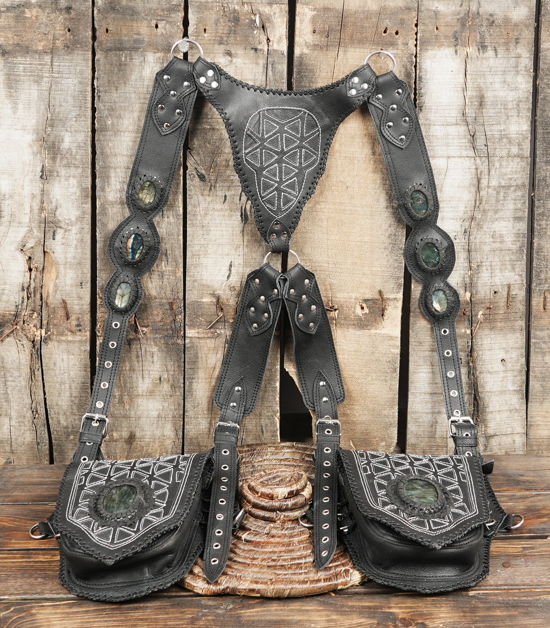Tribal inspired leather holster with ornamental stitching and detachable pockets