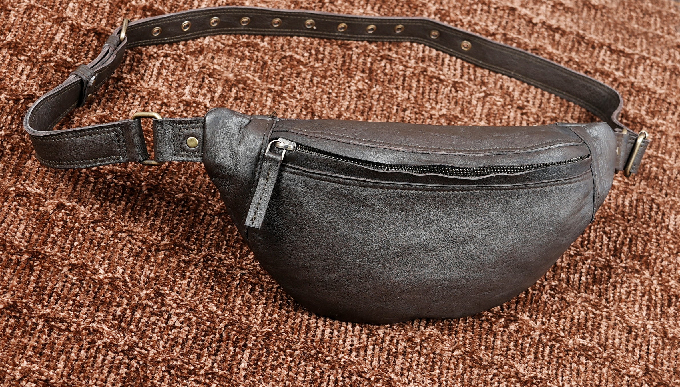 Compact leather waist belt for secure and easy carrying