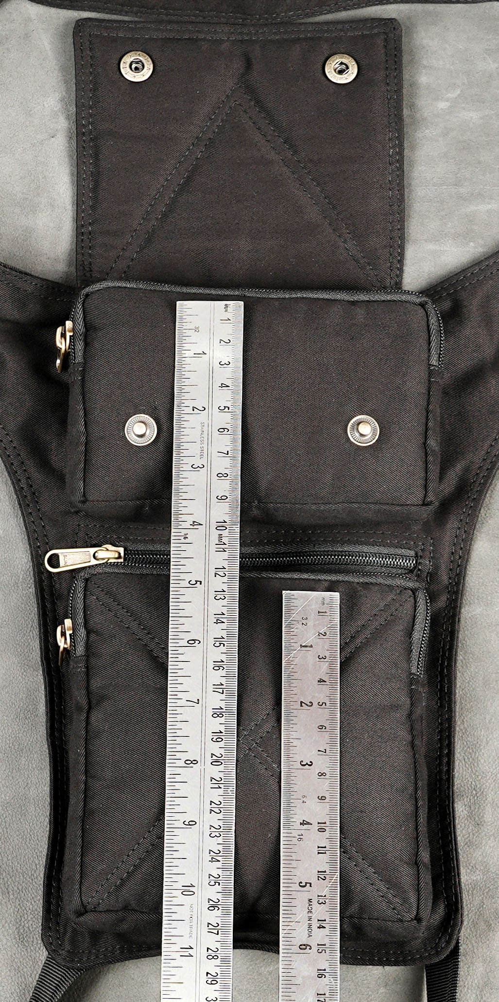 Black canvas festival leg bag with zipper and snap pockets