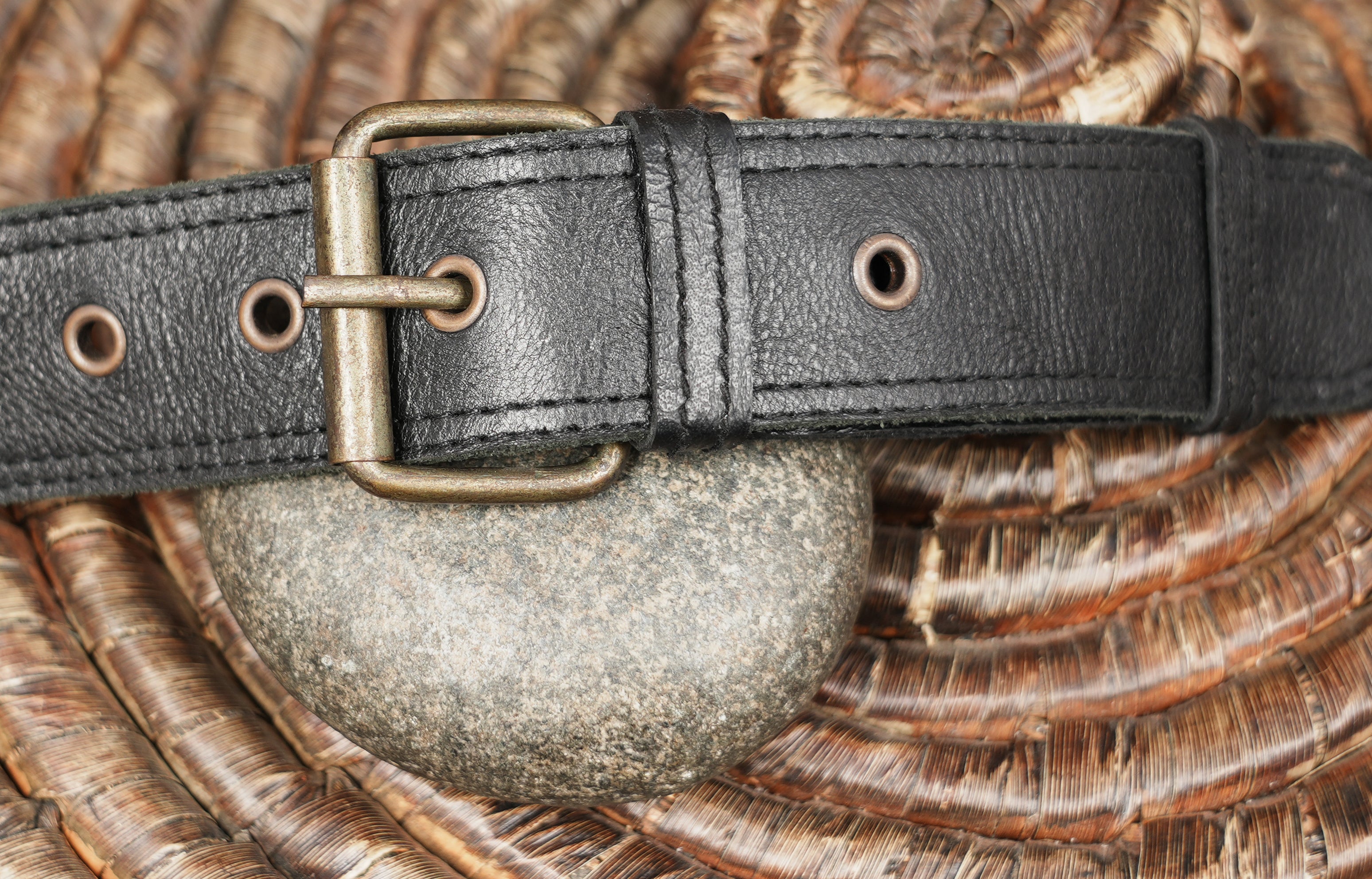 Adjustable black leather hip bag with front flap pocket