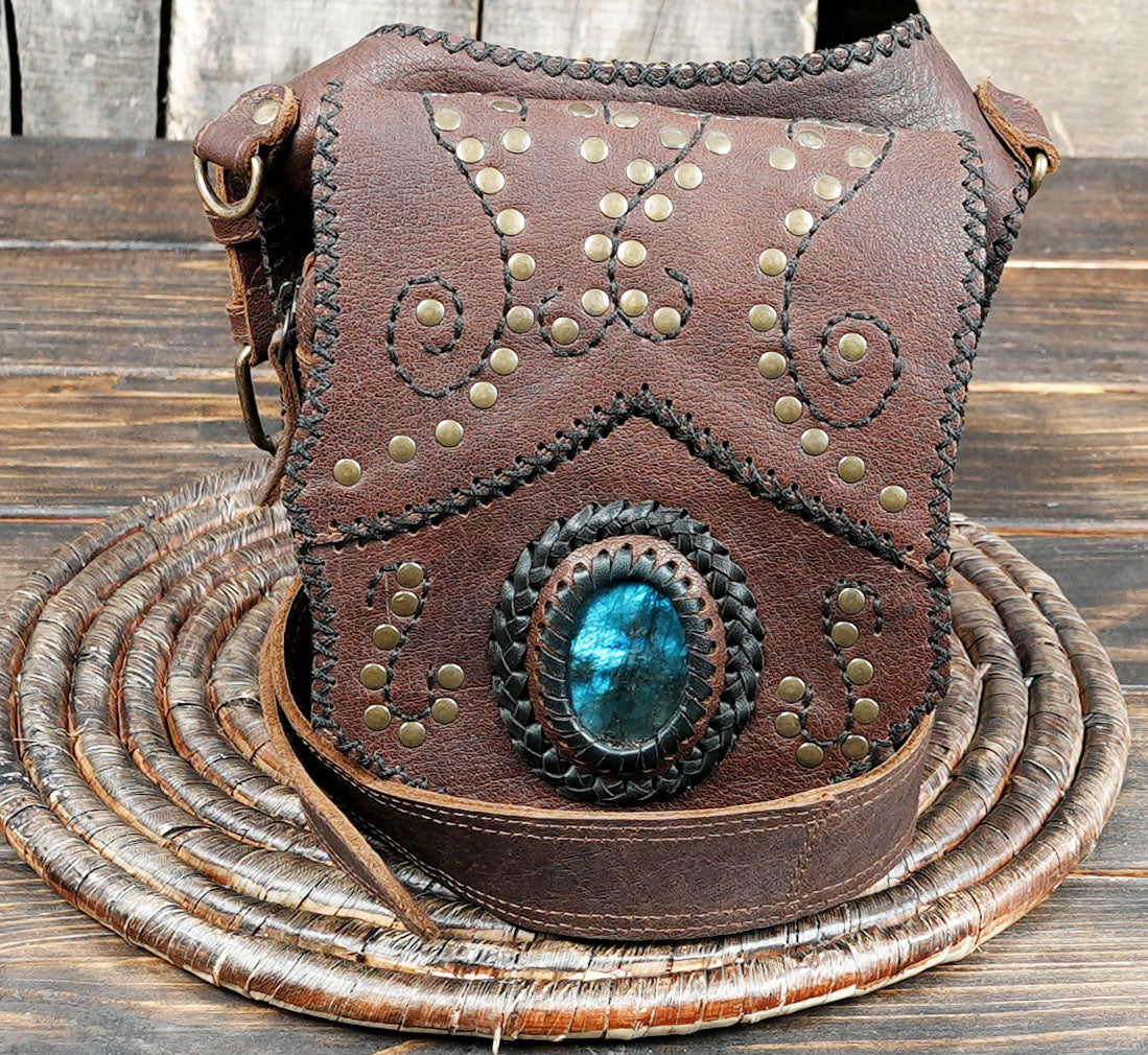 Brown leather waist belt with round woven pouch design