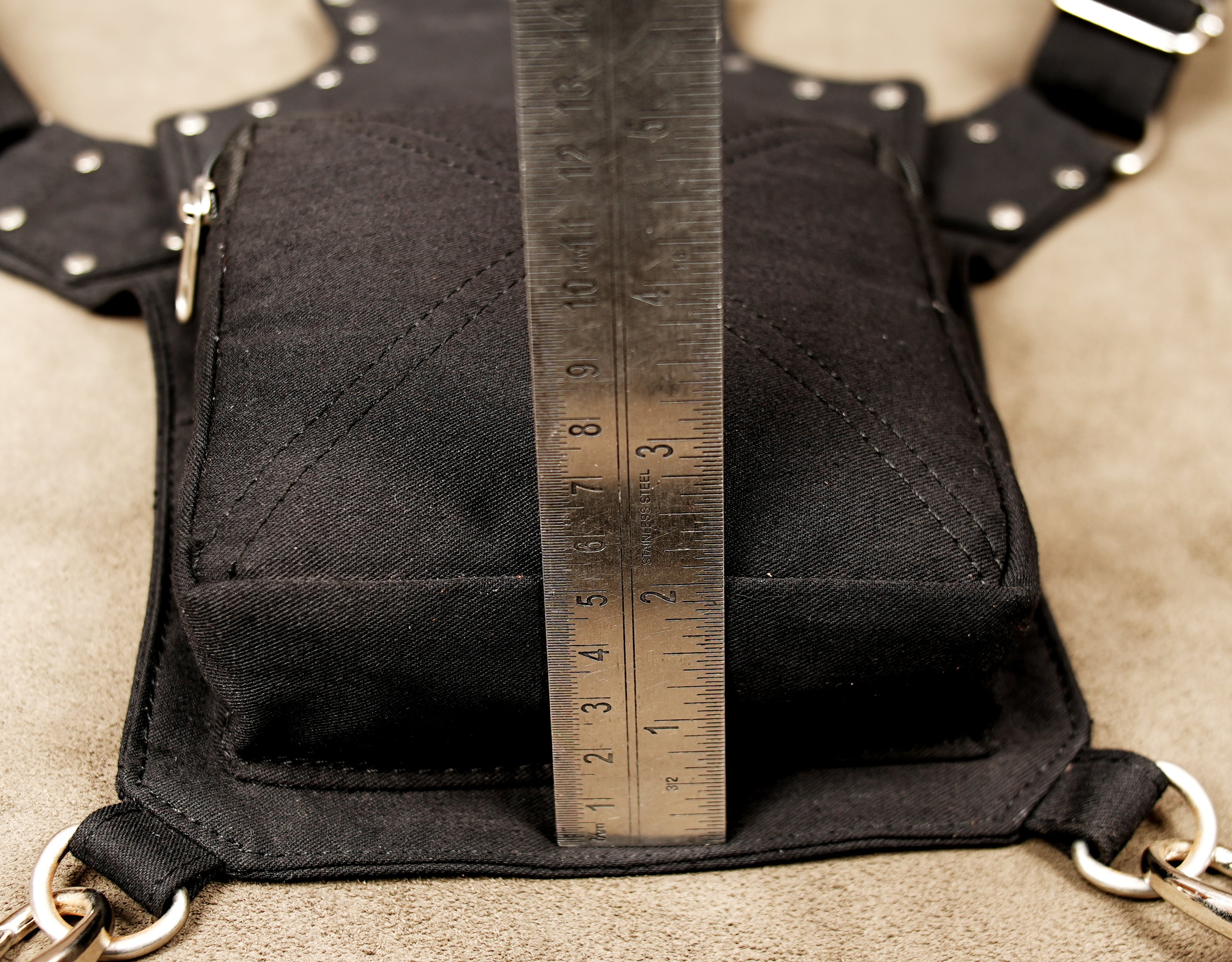 The central heart motif is made of textured leopard print leather (or faux leather) with a teardrop gem.