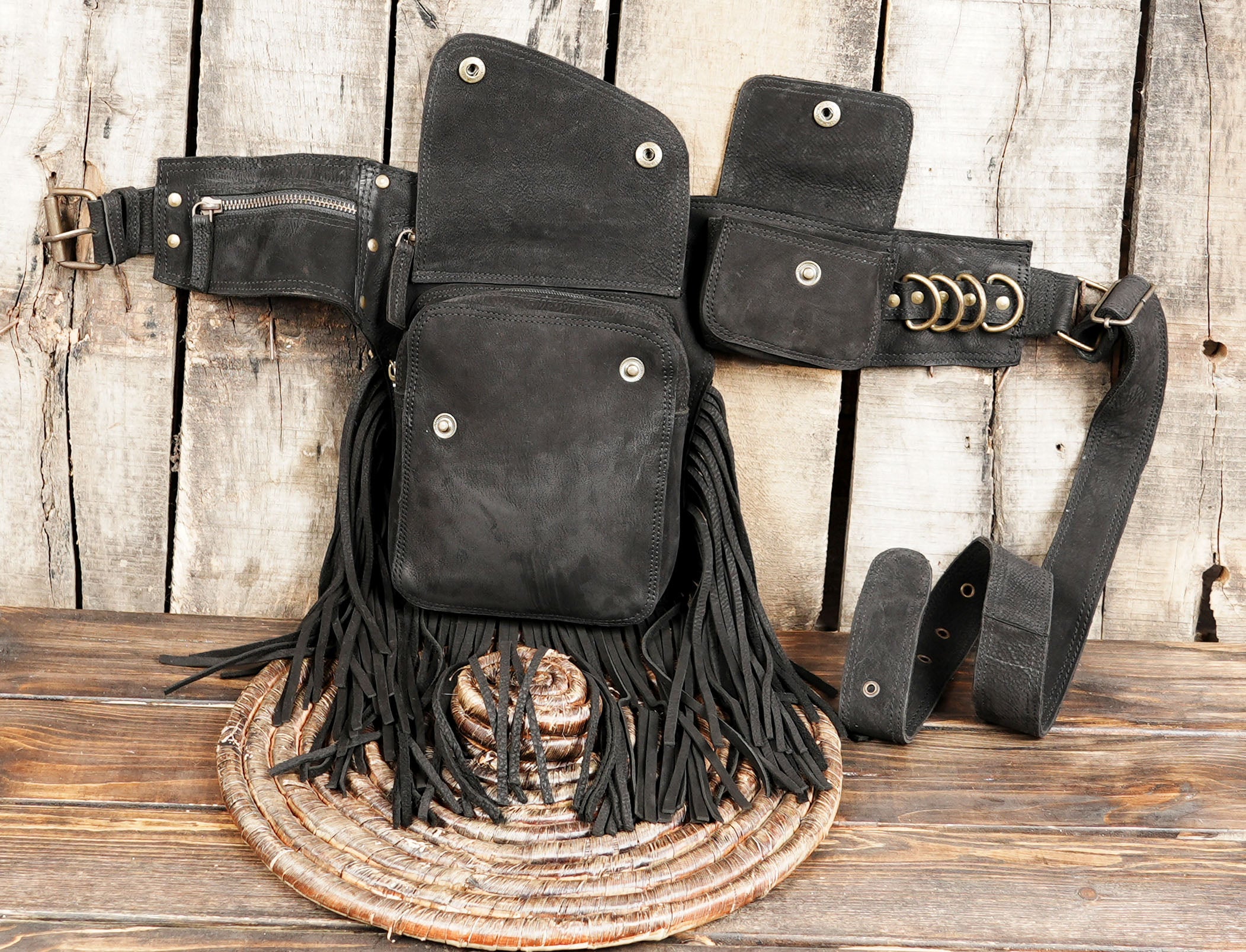 Black leather waist belt with thigh drop pouch and fringe detail