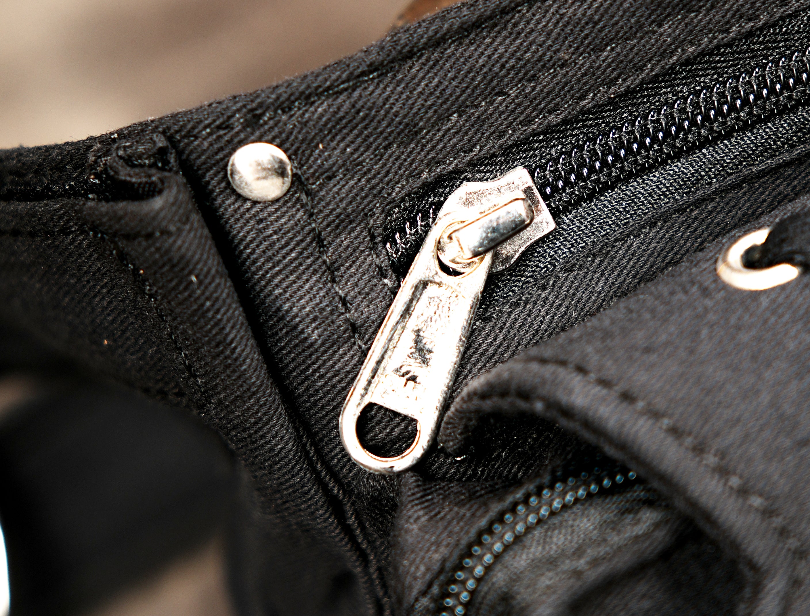 Adjustable cotton waist pouch with secure metal closures, top-down product view.