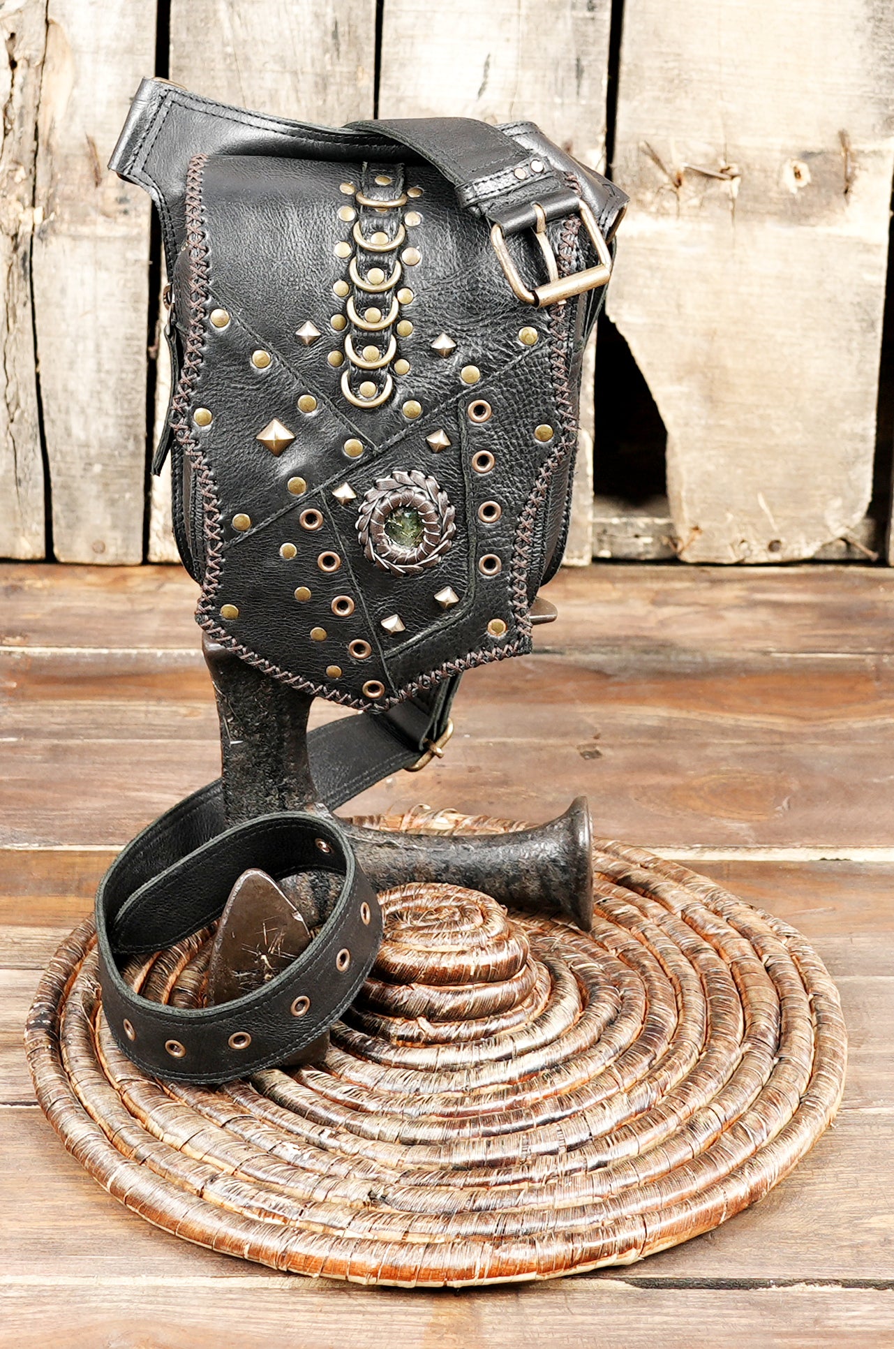 Black leather waist belt with handcrafted stud pattern and stitching