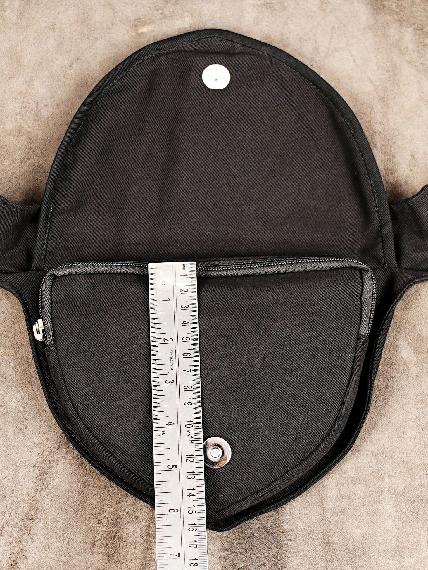 Black crossbody waist bag with functional pockets